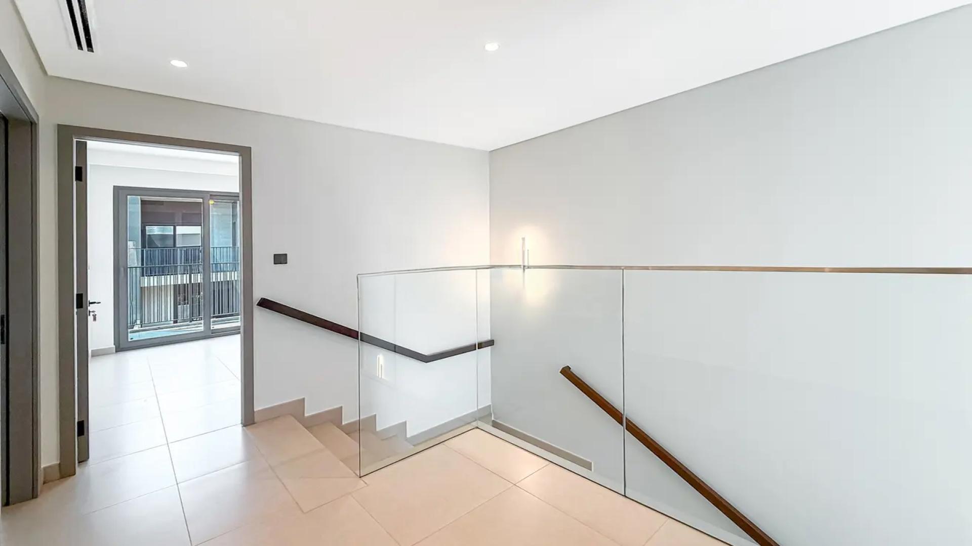 Modern kitchen in Aura Gardens townhouse, Tilal Al Ghaf, available for rent