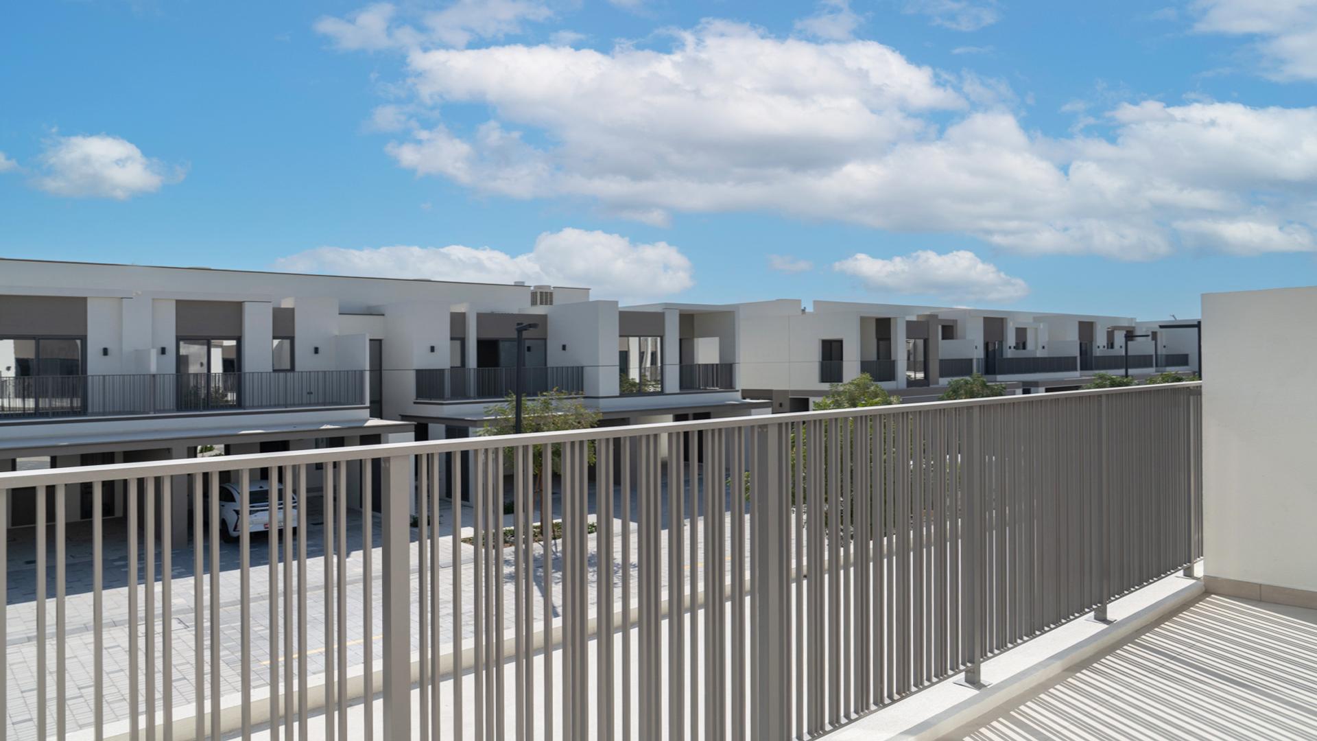 Front entrance of three-bedroom townhouse in Aura Gardens, Tilal Al Ghaf for rent