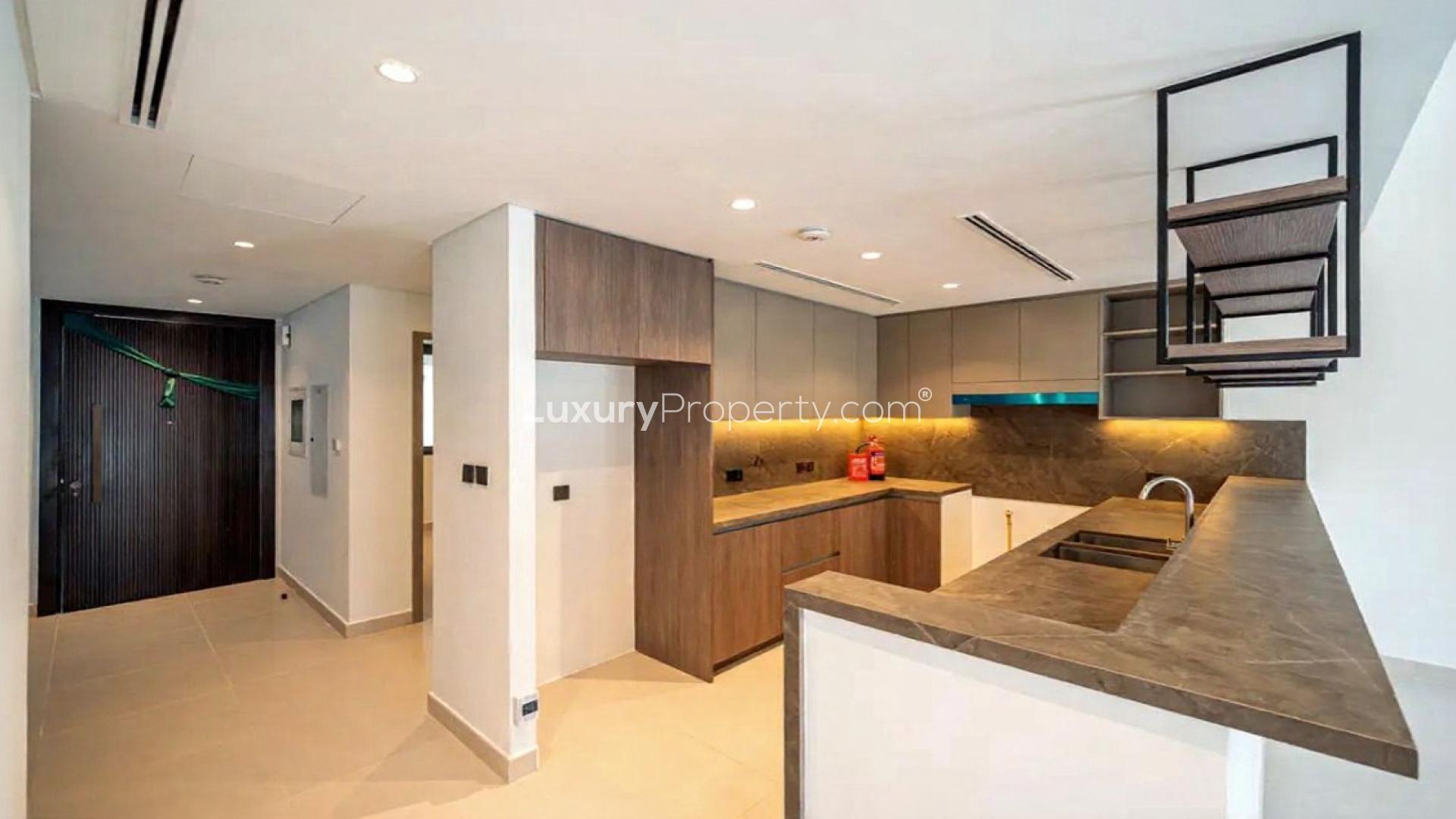 Empty bedroom with large window, natural light in Aura Gardens townhouse, Tilal Al Ghaf