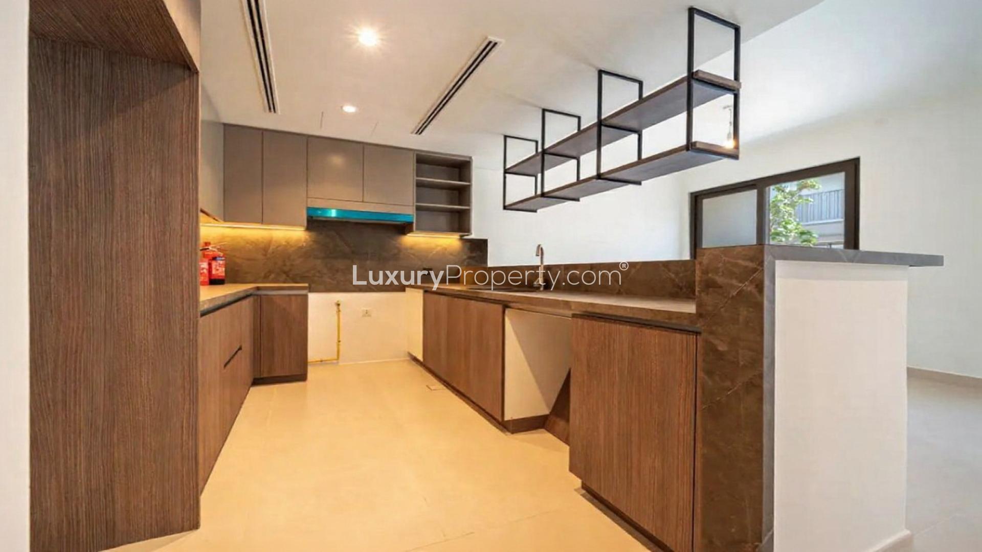 Modern kitchen in 3-bedroom townhouse for rent, Aura Gardens, Tilal Al Ghaf