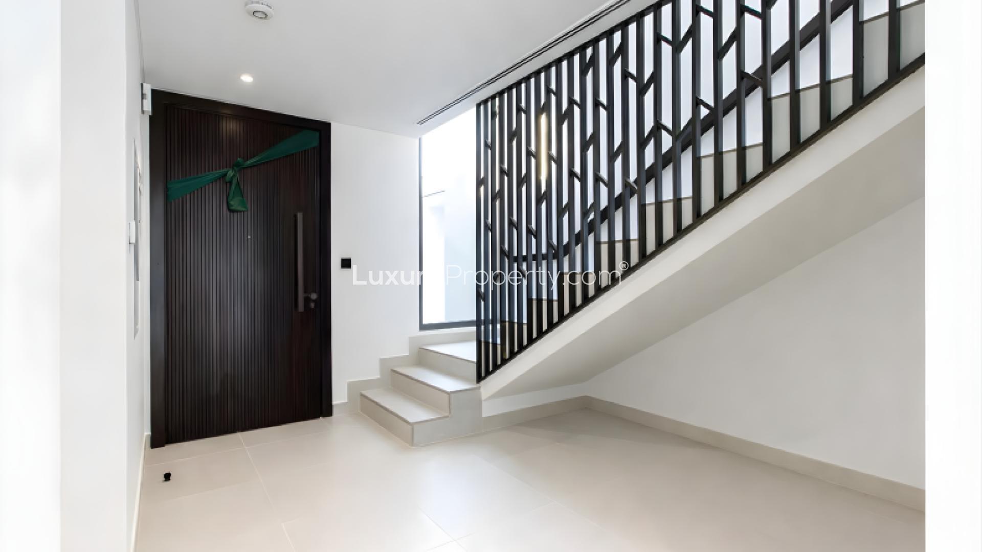 Modern 3-bedroom townhouse exterior at Aura 3, Tilal Al Ghaf, available for rent