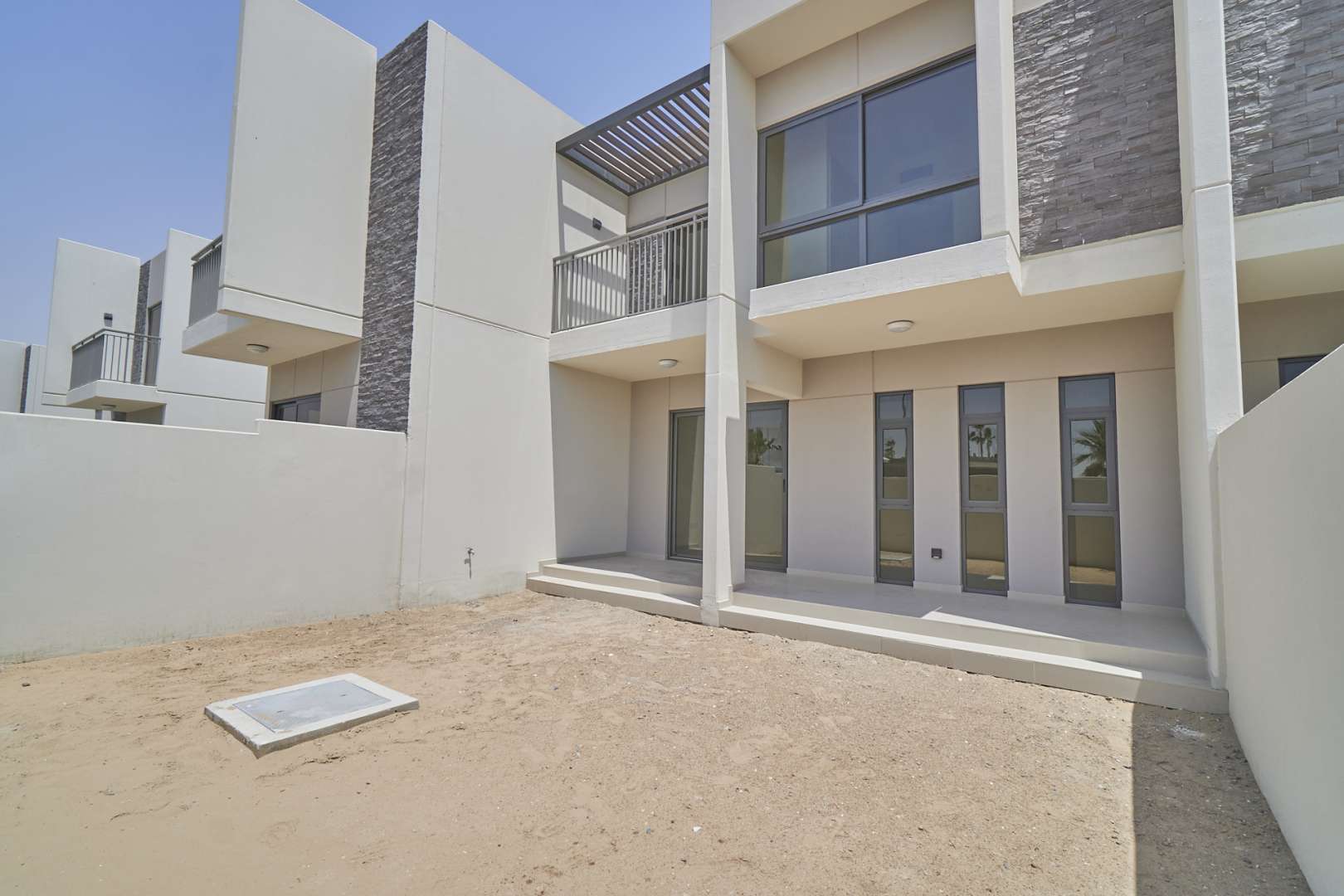 Three-bedroom townhouse exterior in Juniper, Akoya Oxygen, available for rent