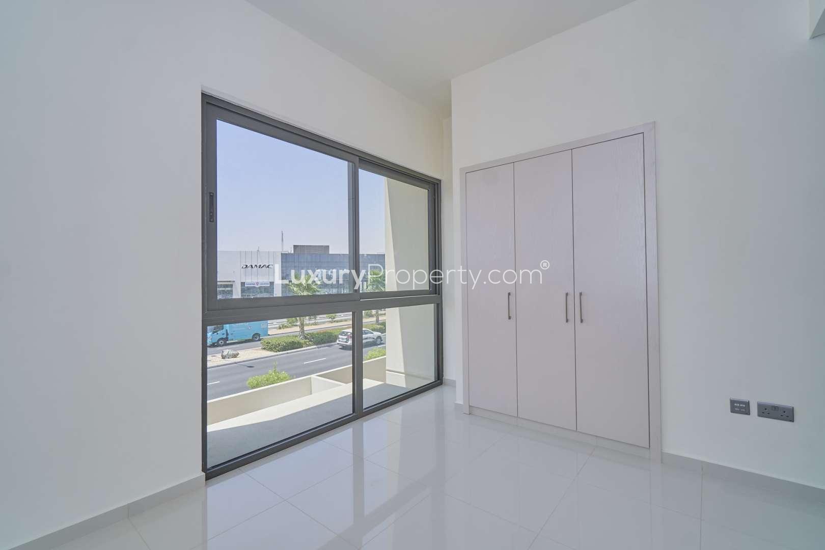 Modern kitchen in 3-bedroom townhouse, Juniper, Damac Hills 2, with sleek cabinets and countertops