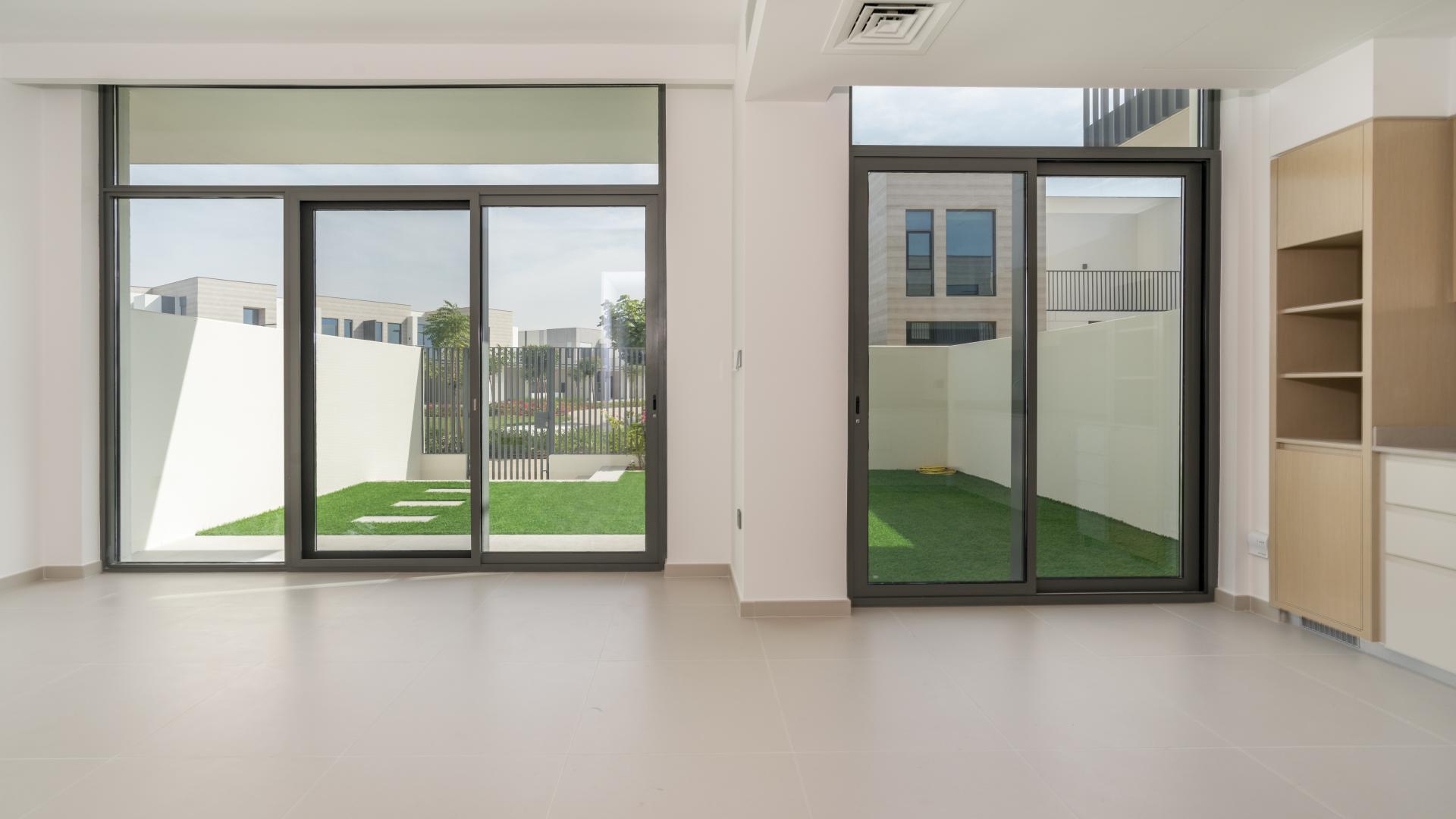 Spacious living area with large windows in Joy, Arabian Ranches III townhouse LP30664