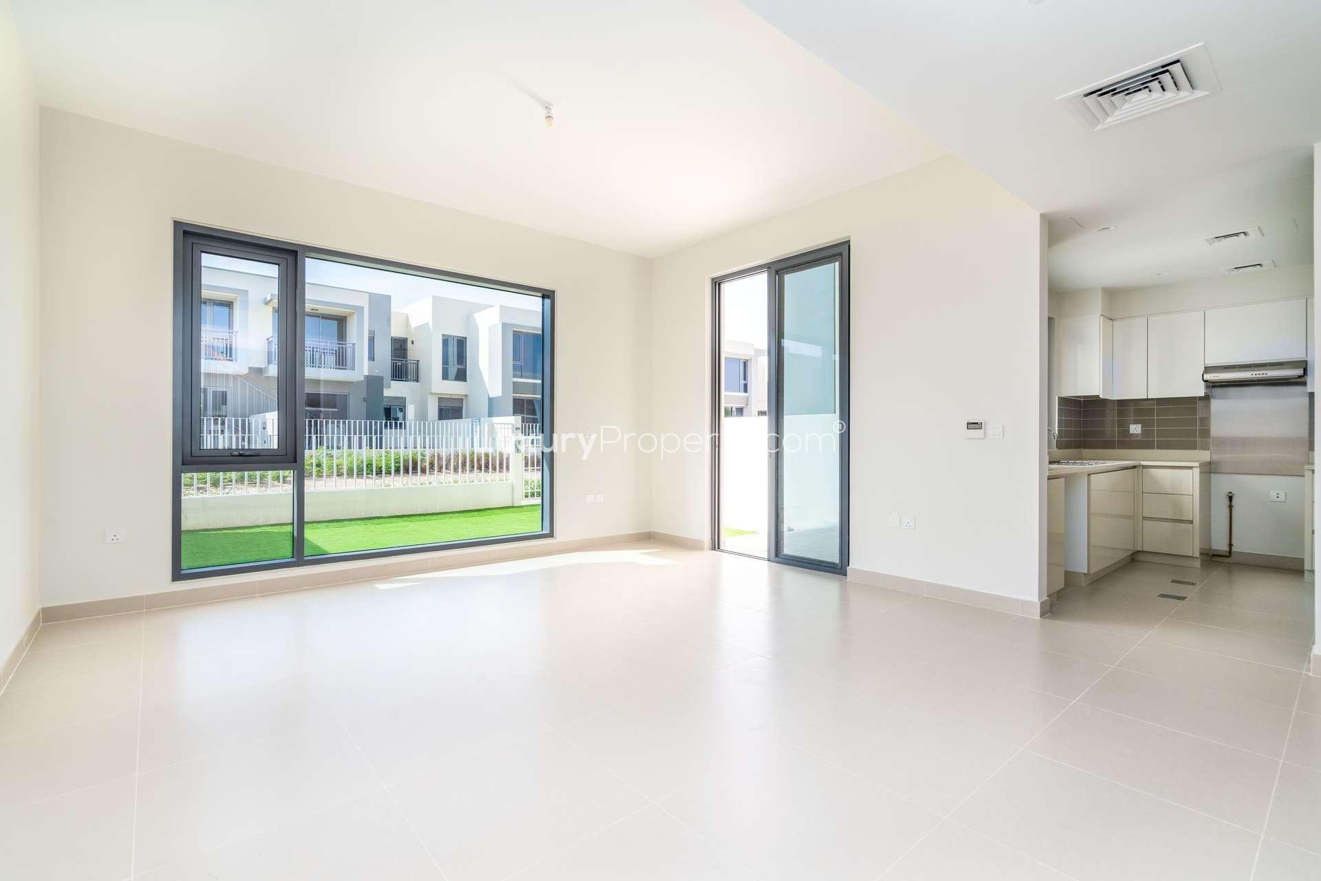 Bright living room in 3-bedroom townhouse, Maple 1, Dubai Hills Estate with garden view
