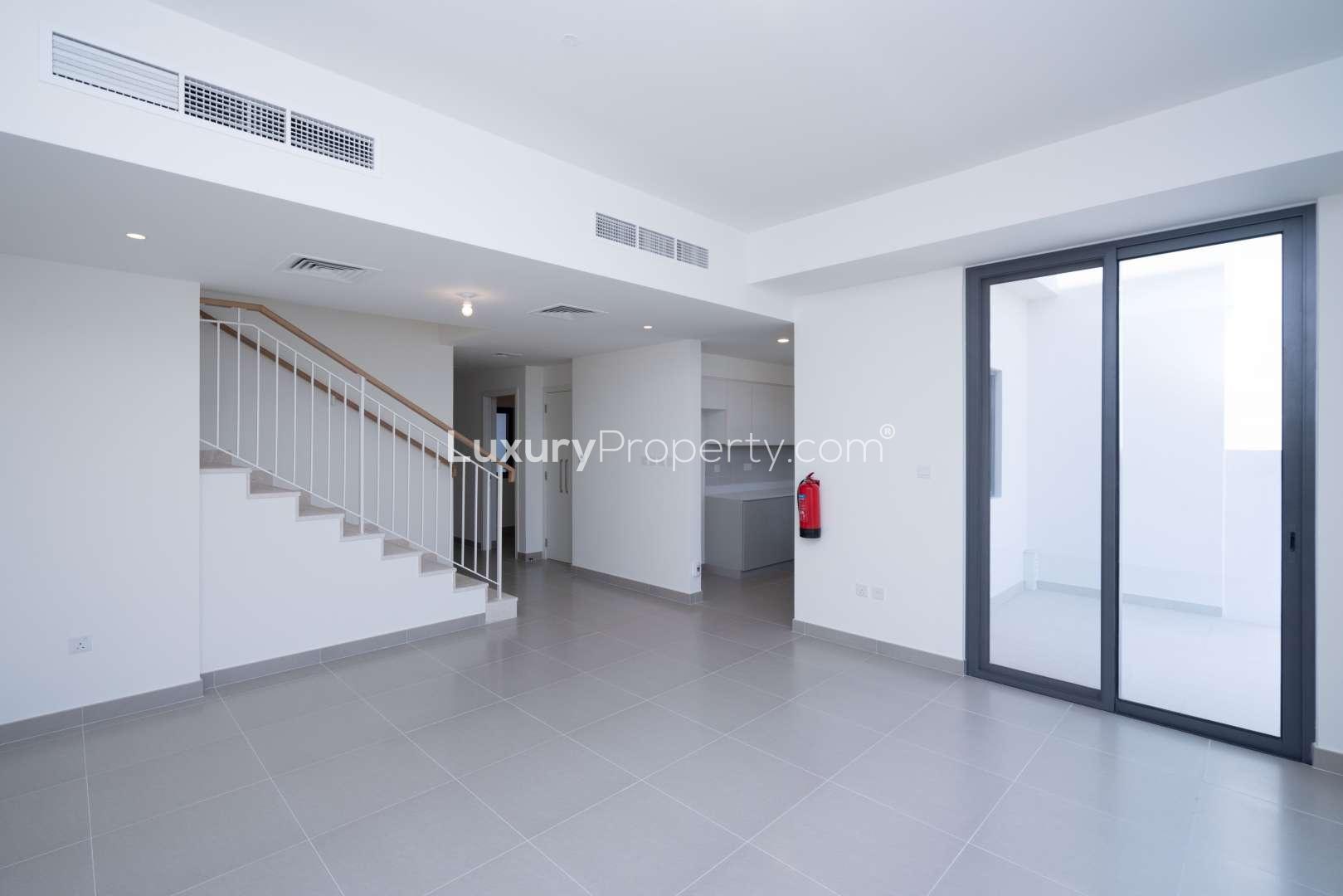 Interior view of a spacious townhouse in Maple, Dubai Hills Estate with modern staircase