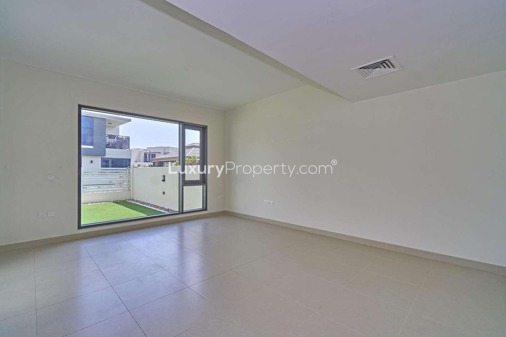 Spacious living room in three-bedroom townhouse, Maple 1, Dubai Hills Estate, large window view