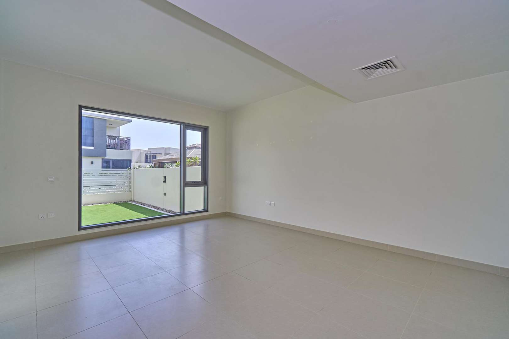 Spacious living room in three-bedroom townhouse, Maple 1, Dubai Hills Estate, large window view