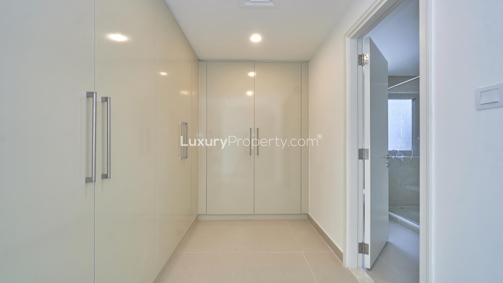 Modern open-plan living room in Maple townhouse, Dubai Hills Estate, featuring bright, spacious interior