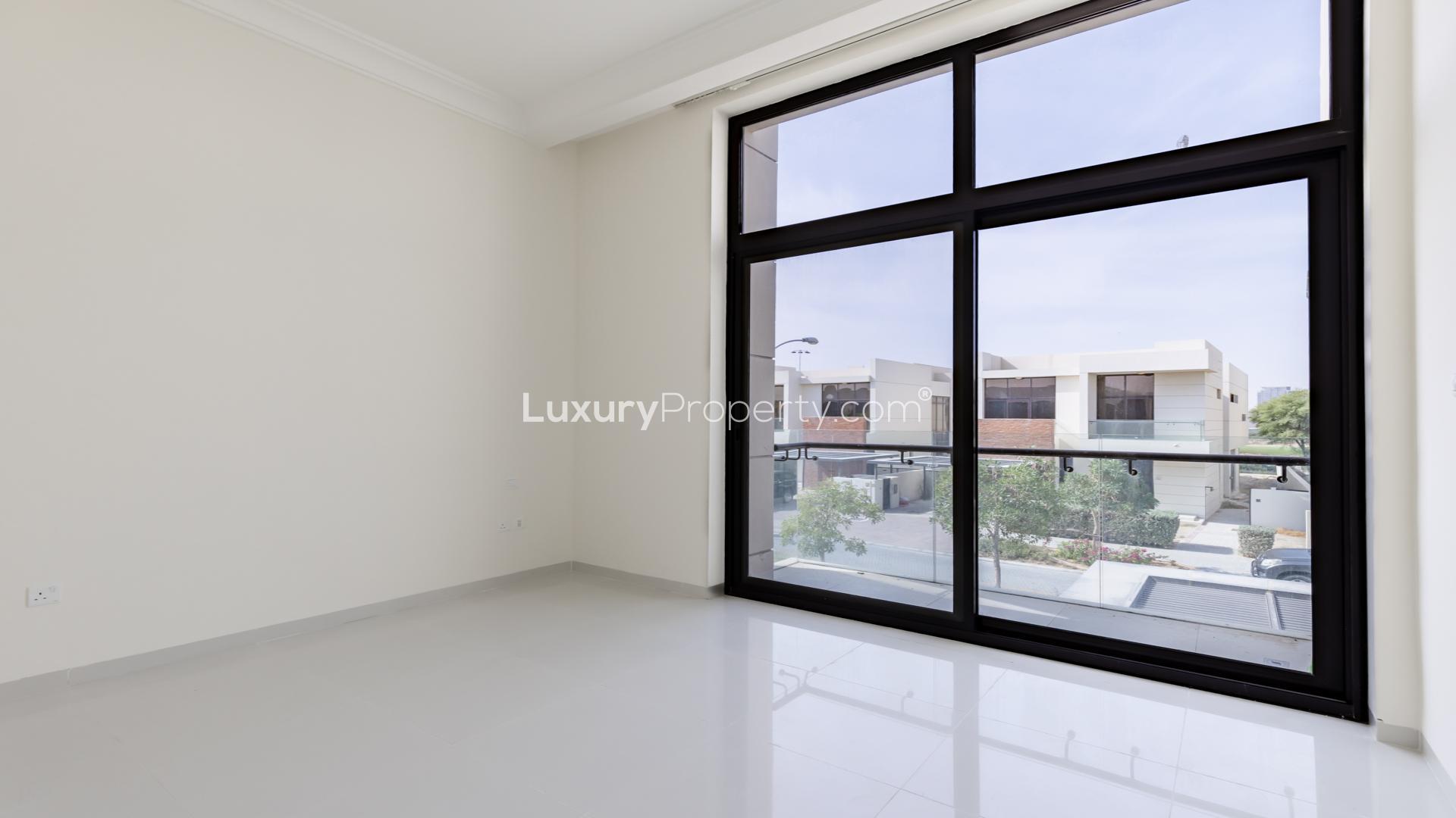 Spacious living room with large windows in 3-bedroom townhouse, Akoya Park, DAMAC Hills