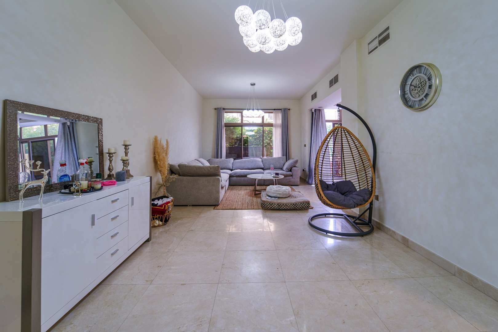 Spacious living room in 3-bedroom townhouse, Meydan Gated Community, Dubai. Modern decor, natural light