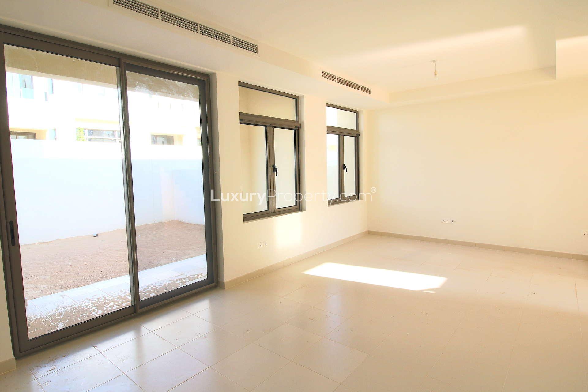 Modern kitchen with granite countertops in 3-bedroom townhouse, Mira Oasis, Dubai