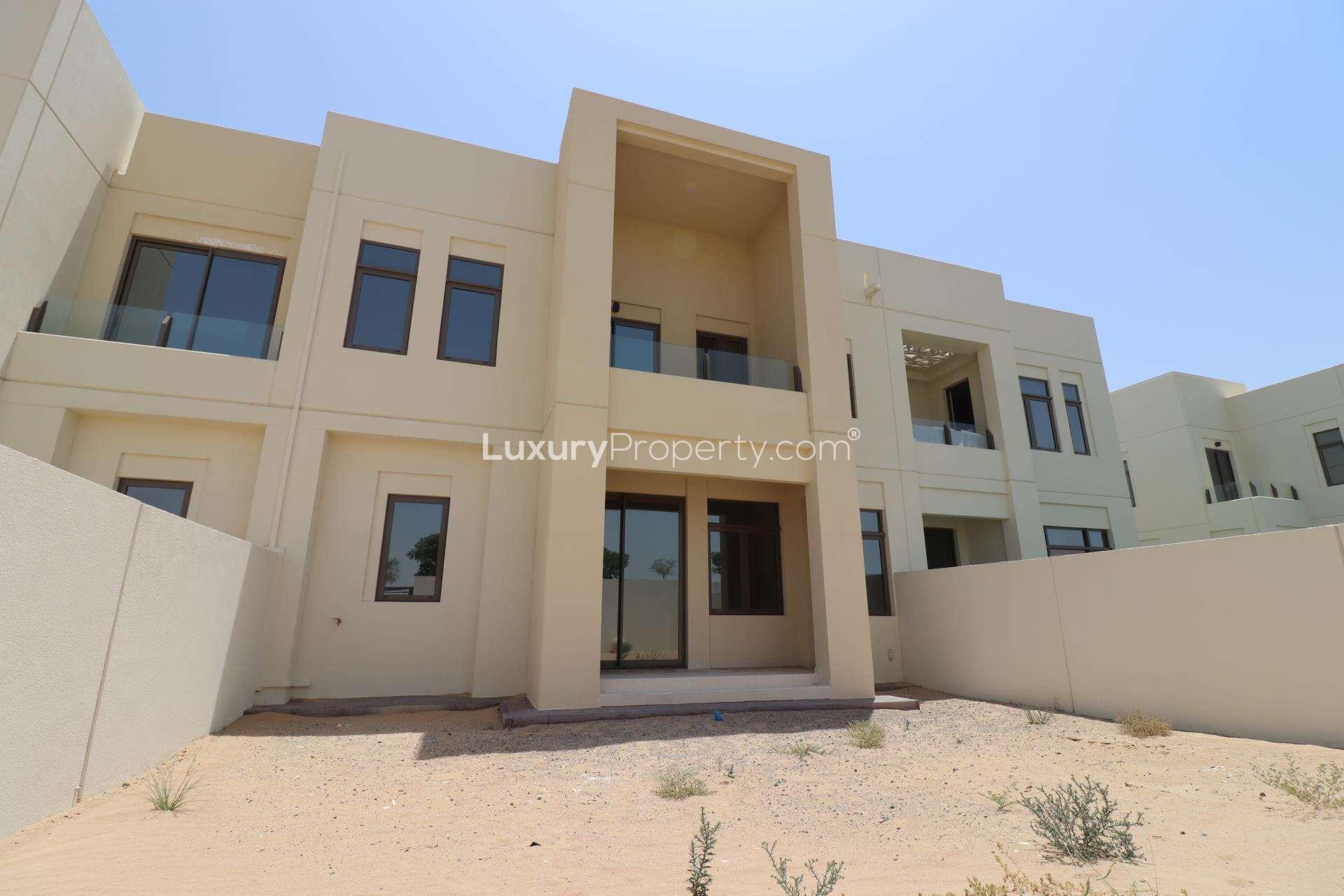 View from 3-bedroom townhouse in Mira Oasis, Dubai, showcasing desert landscape and garden