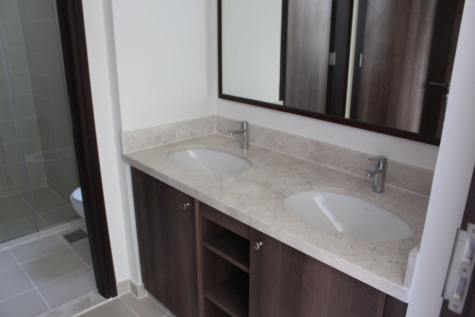 Modern bedroom with built-in wardrobe in Mira Oasis 3 townhouse, Reem community