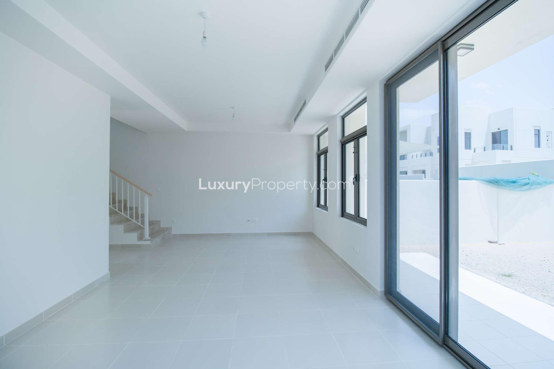 Elegant bathroom with dual sinks and bathtub in Mira Oasis townhouse, Dubai rental property