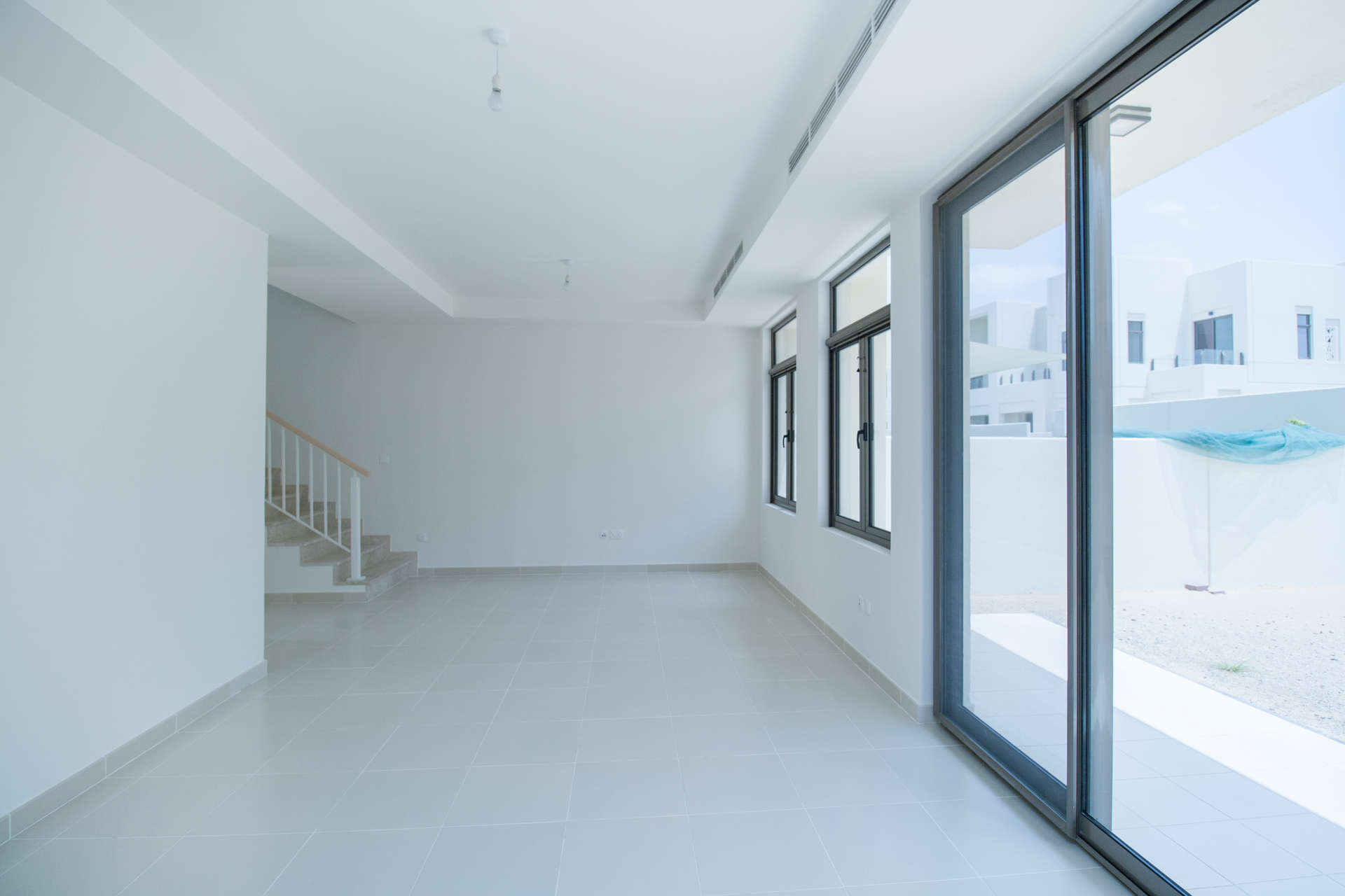 Elegant bathroom with dual sinks and bathtub in Mira Oasis townhouse, Dubai rental property
