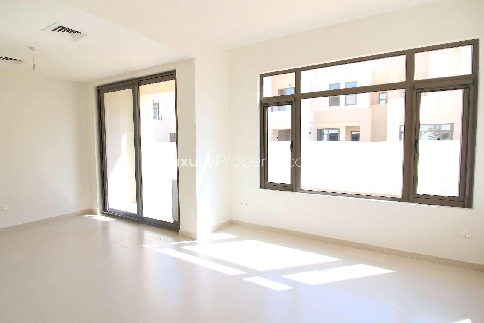 Corner 3-bedroom townhouse exterior in Mira Oasis, Reem, available for rent with garden views