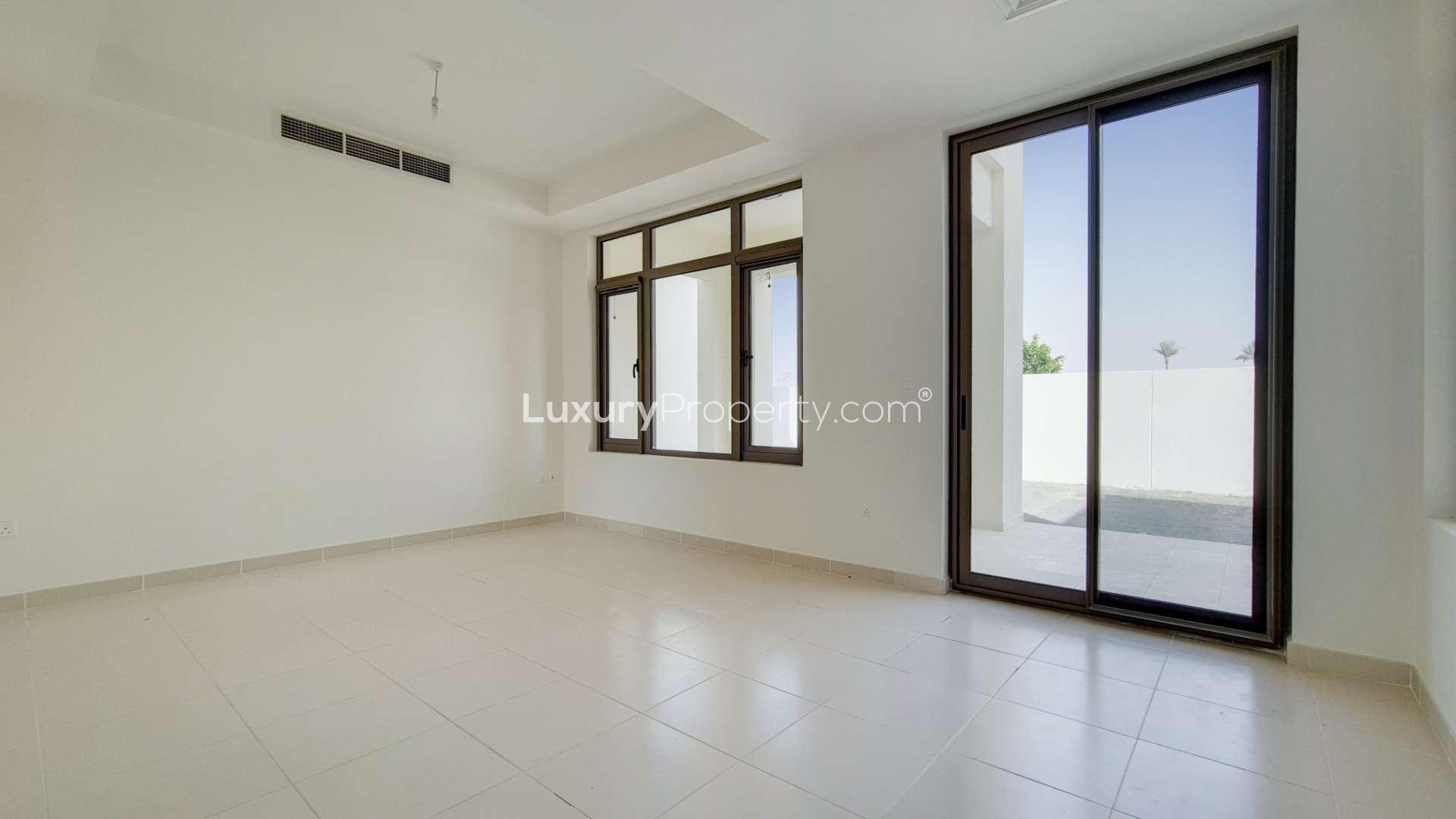 Charming townhouse exterior in Mira Oasis 3 with garage and modern architecture