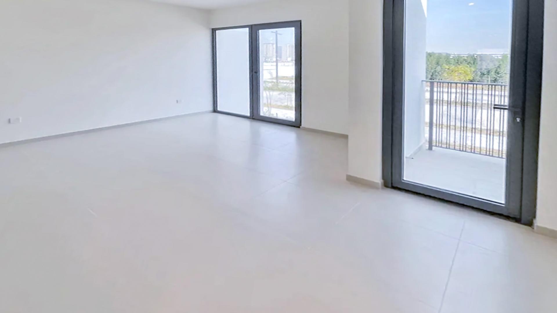 Spacious living area with large windows in Elan townhouse, Tilal Al Ghaf for rent