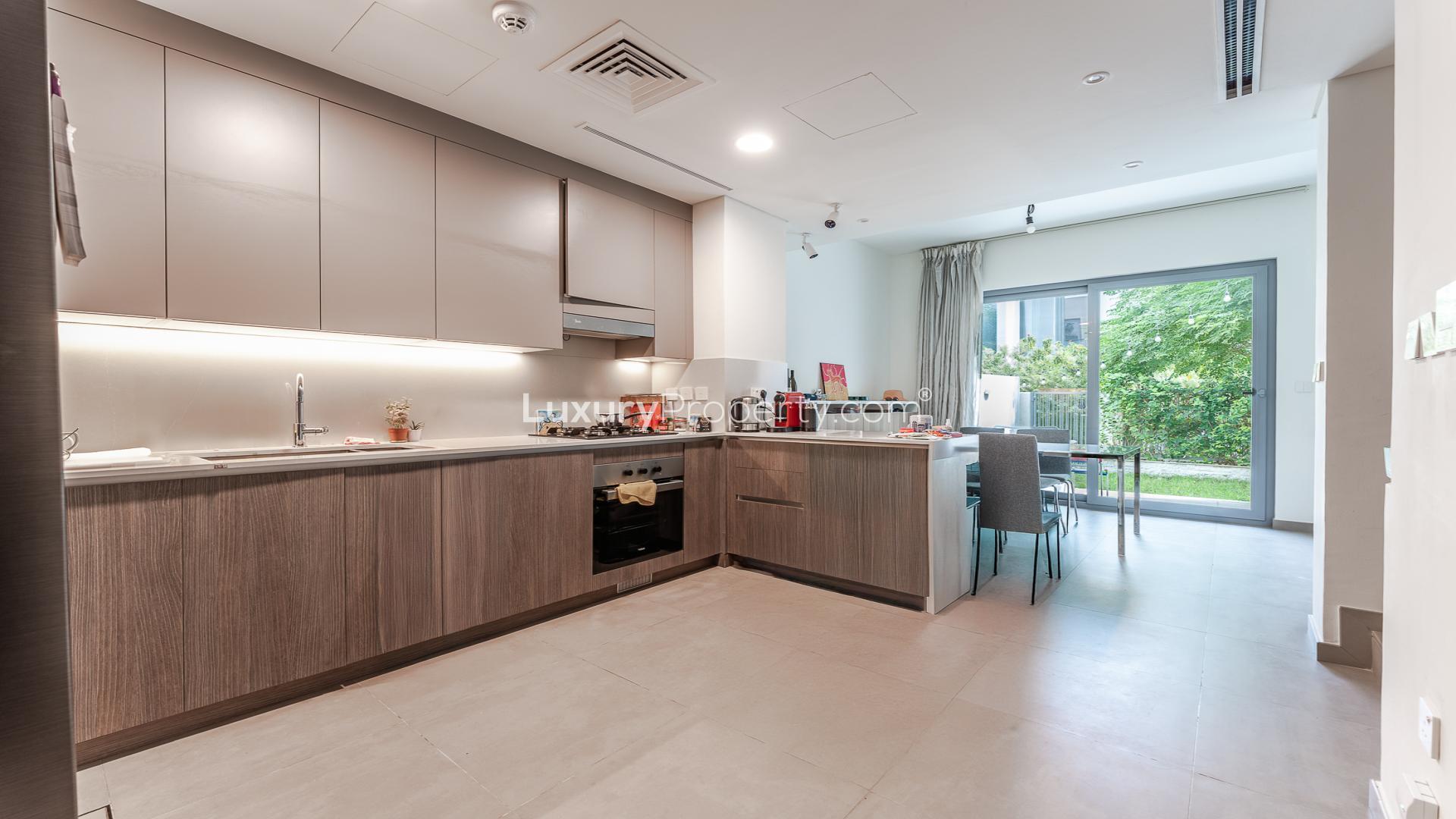 Townhouse exterior in Elan, Tilal Al Ghaf, available for rent with parking and community amenities