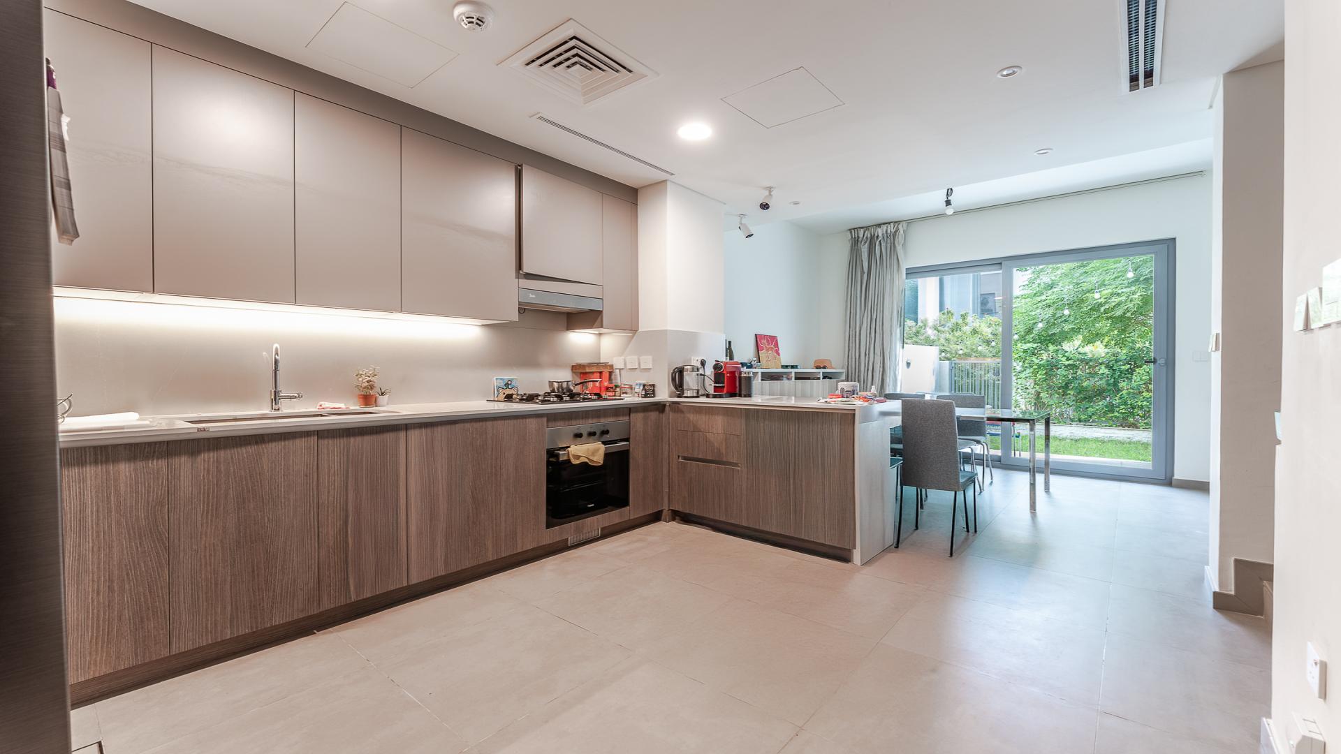 Townhouse exterior in Elan, Tilal Al Ghaf, available for rent with parking and community amenities