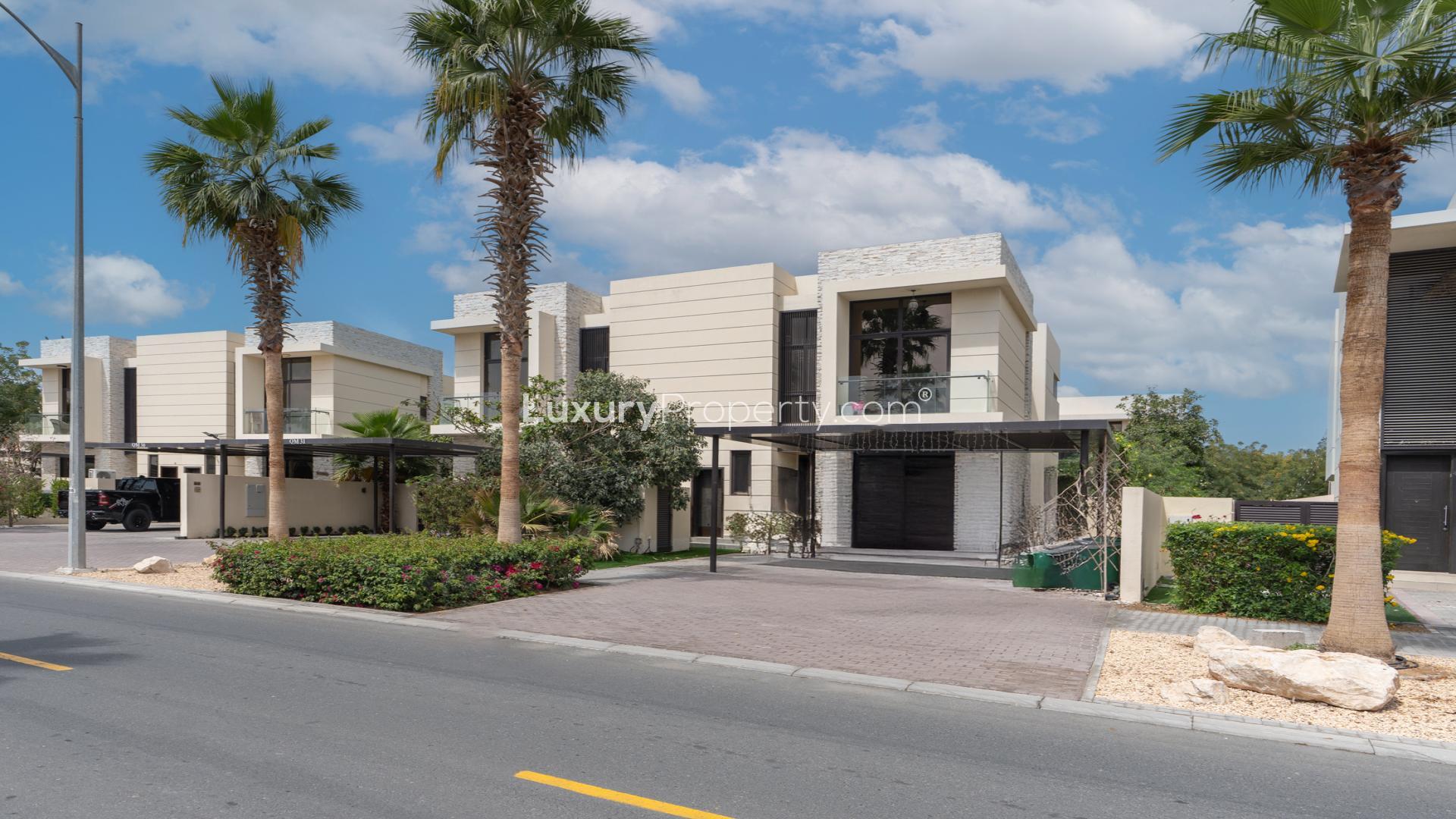 Luxurious living room in Damac Hills townhouse for rent, featuring elegant decor and chandeliers