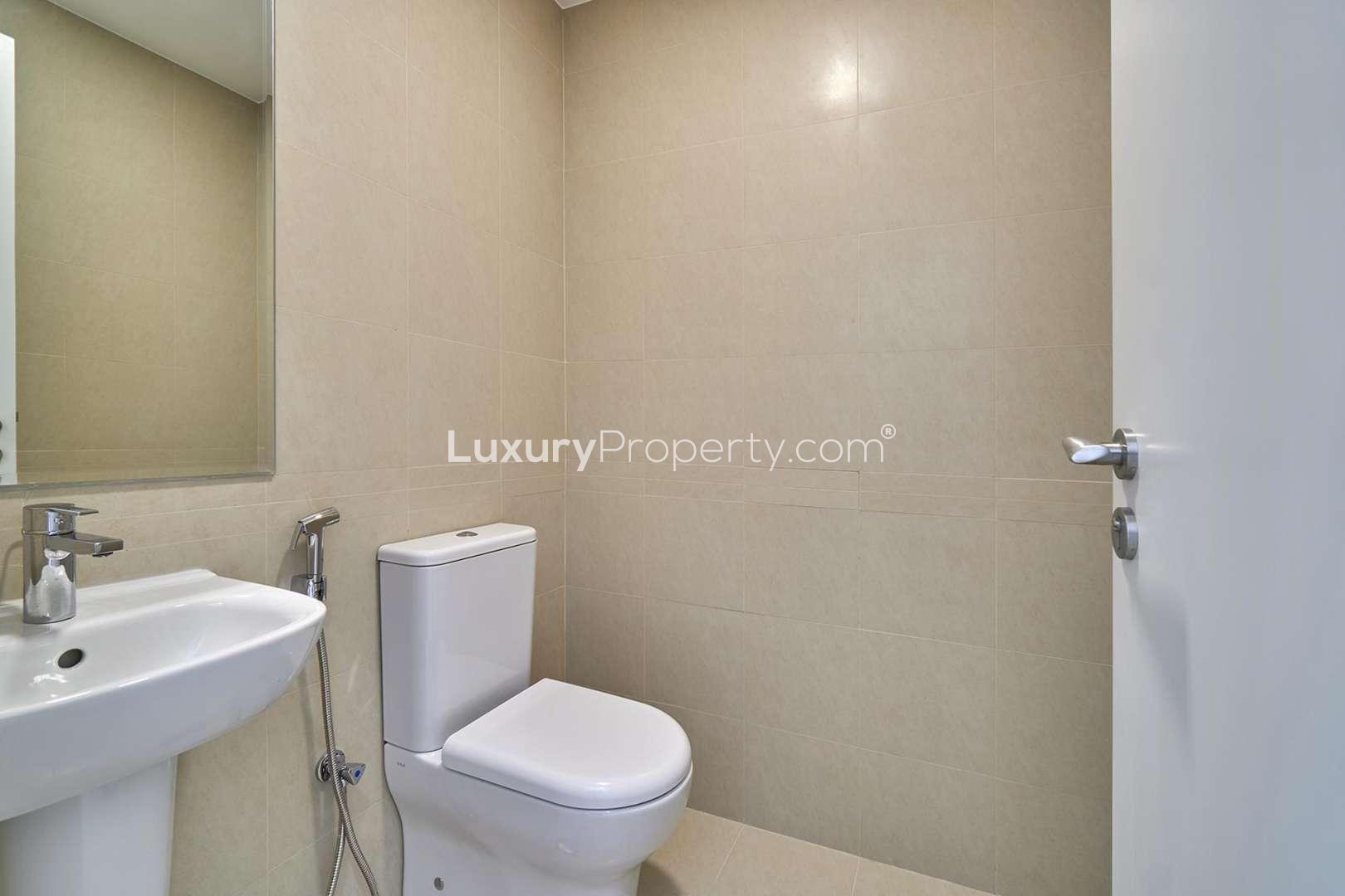 Modern bathroom in 3-bedroom townhouse, Naseem, Town Square, featuring sleek fixtures and neutral tiles