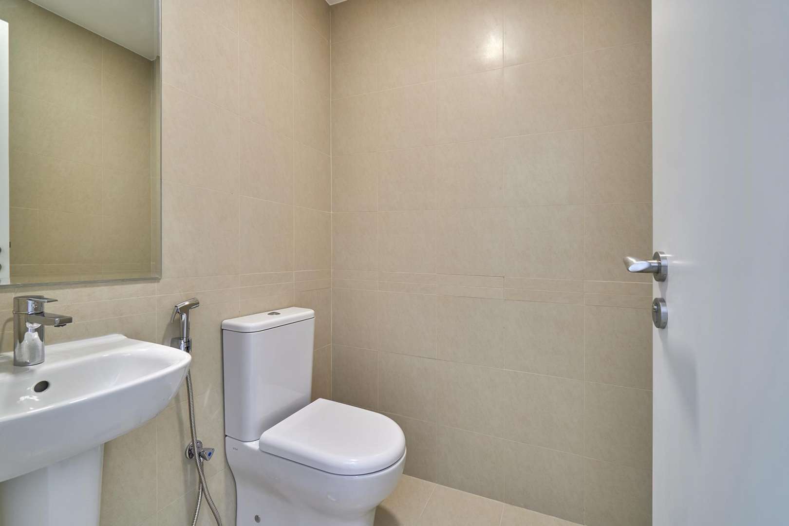Modern bathroom in 3-bedroom townhouse, Naseem, Town Square, featuring sleek fixtures and neutral tiles