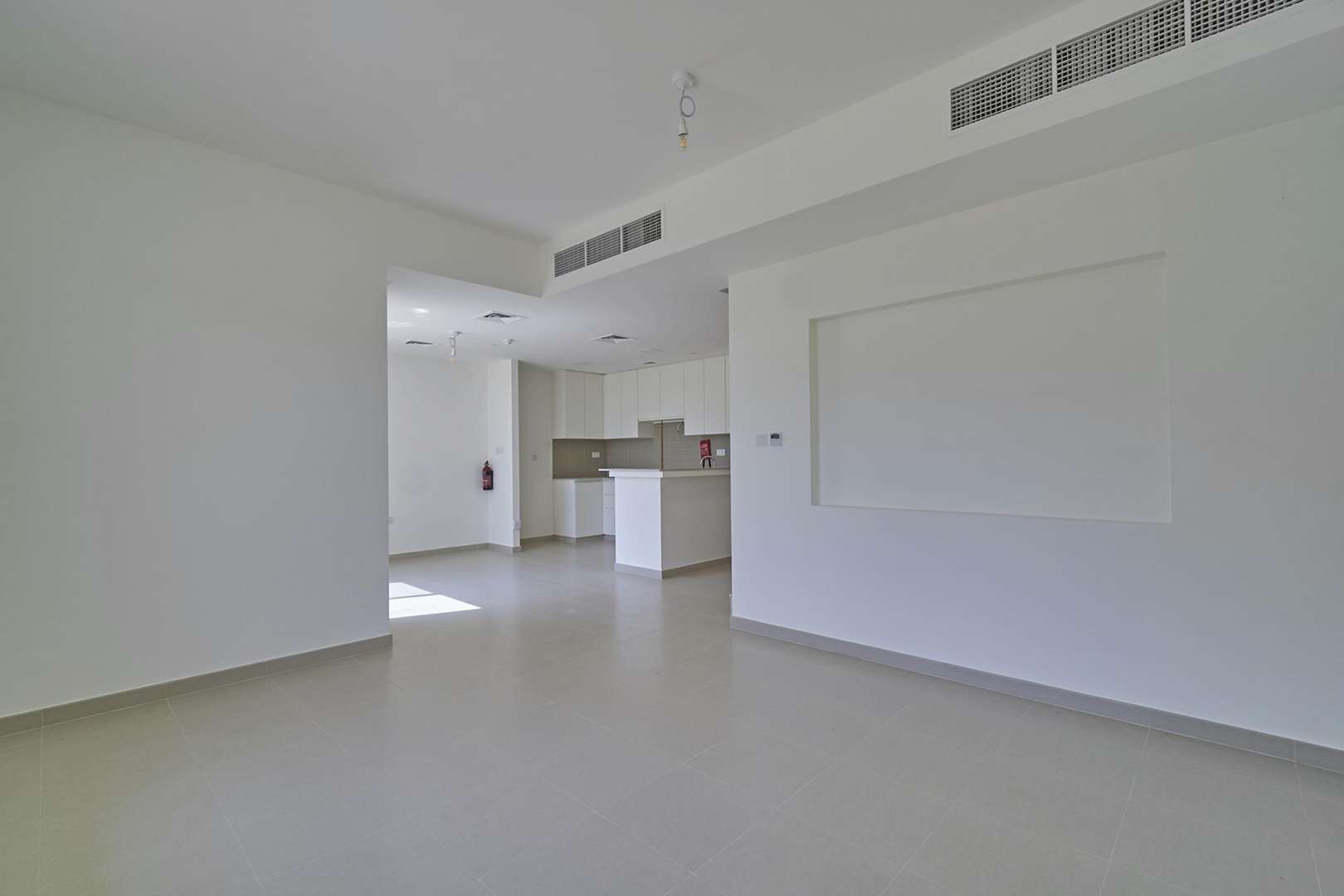 Outdoor view of Naseem Townhouses community playground and pool in Town Square