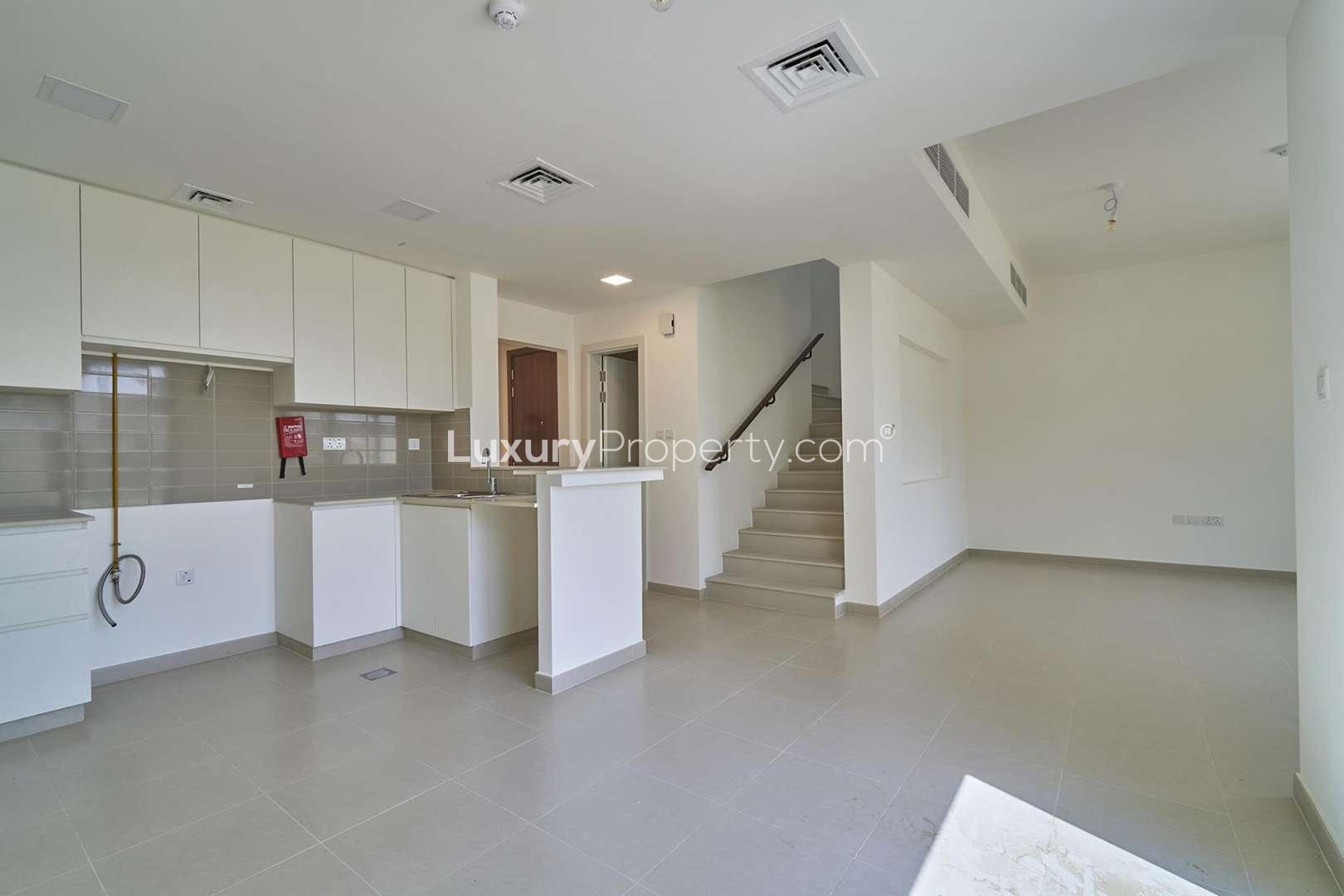 Spacious 3-bedroom townhouse exterior in Naseem Townhouses, Town Square, available for rent