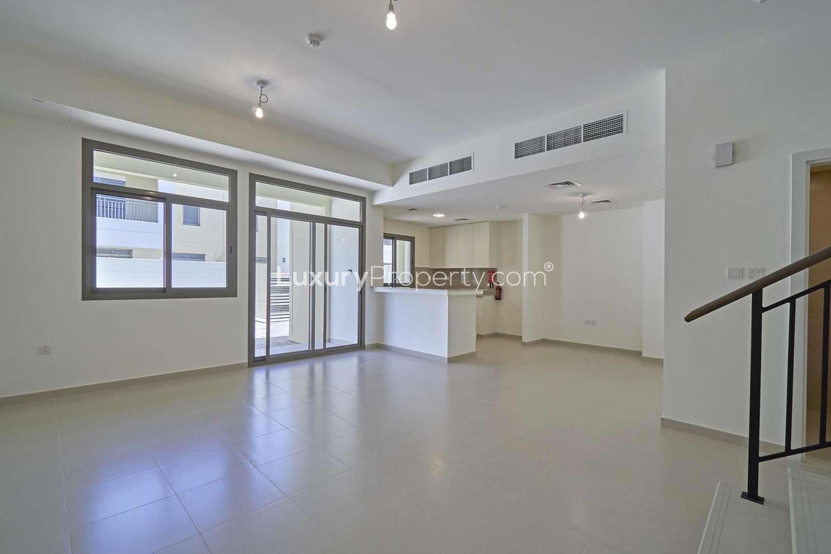Modern kitchen in Naseem Town Square townhouse for rent, featuring sleek cabinetry and ample light