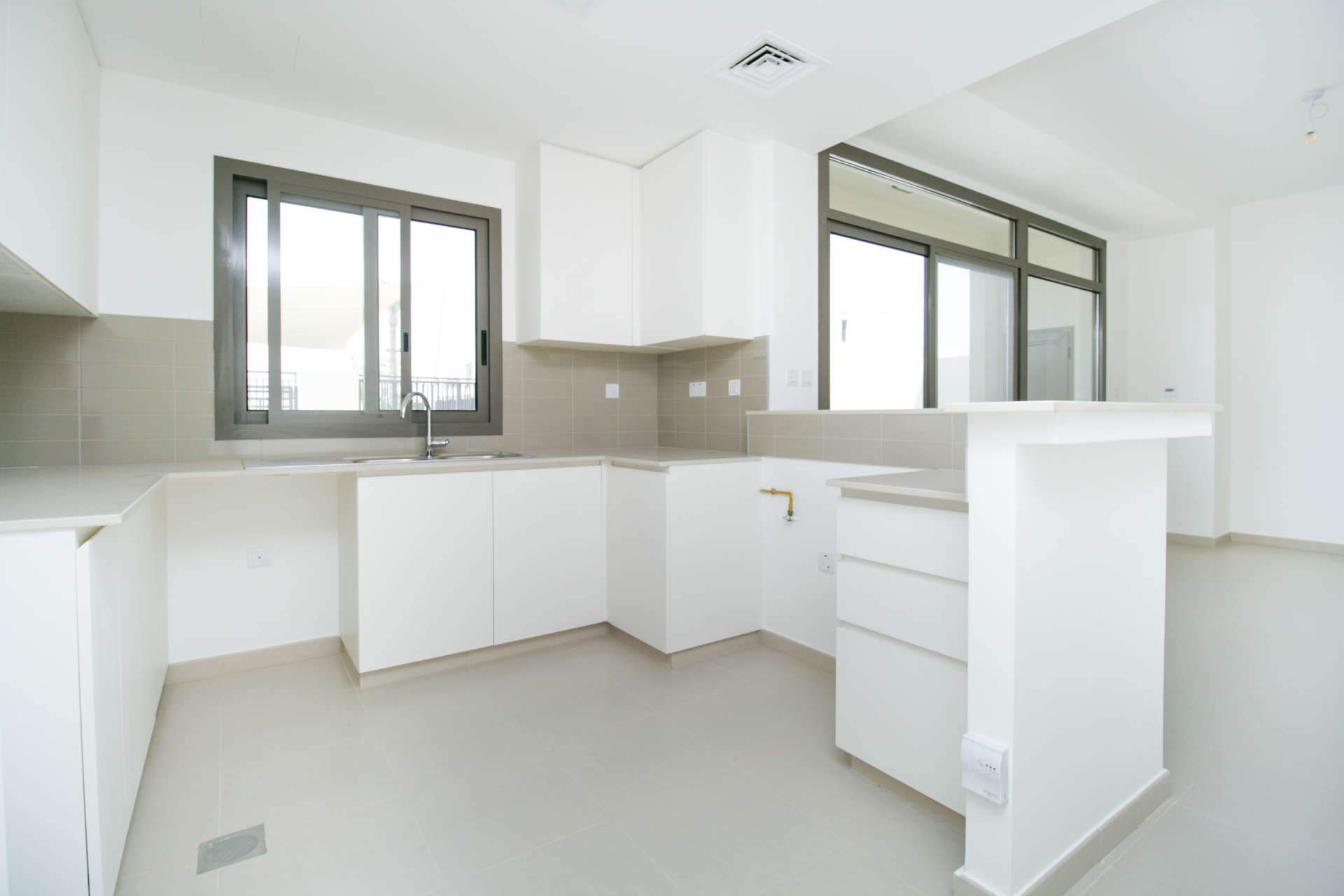 Open-plan living area in 3-bedroom townhouse for rent, Town Square community