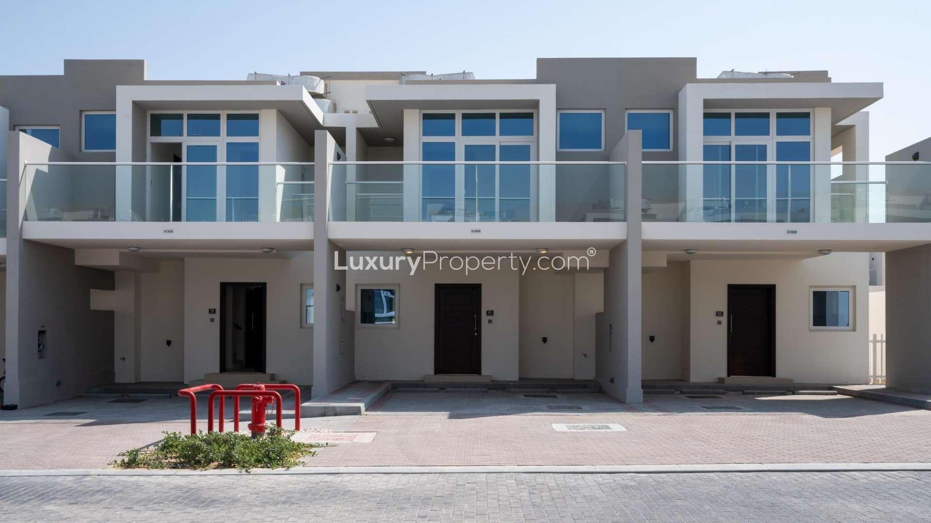 Modern gym in Damac Hills 2 townhouse community, fully equipped with fitness machines and weights