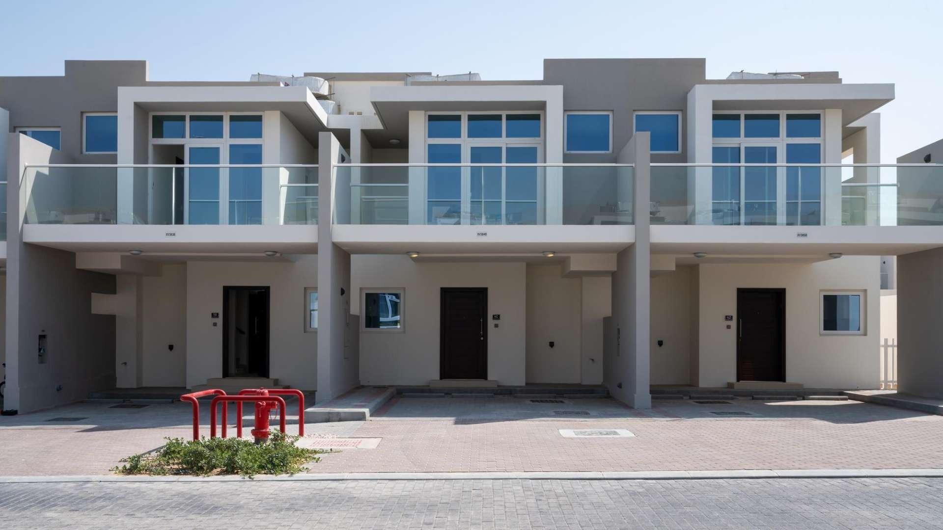 Modern gym in Damac Hills 2 townhouse community, fully equipped with fitness machines and weights