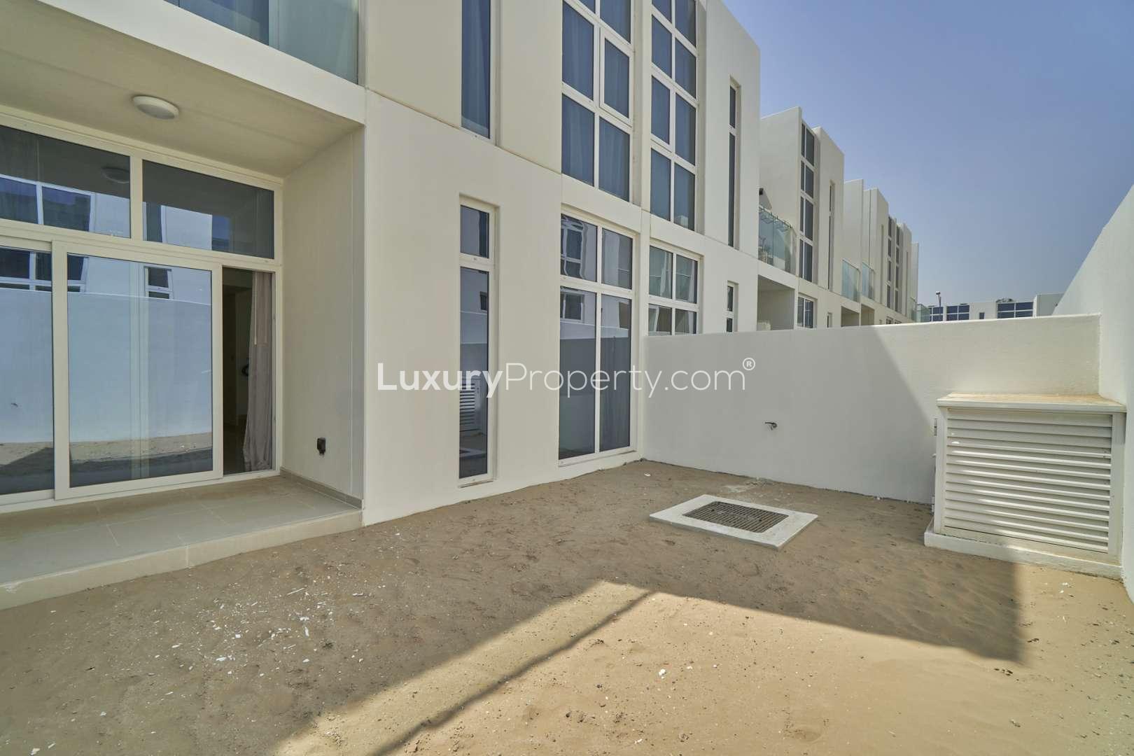 Exterior view of townhouse backyard in Damac Hills 2, Sanctuary, for rent