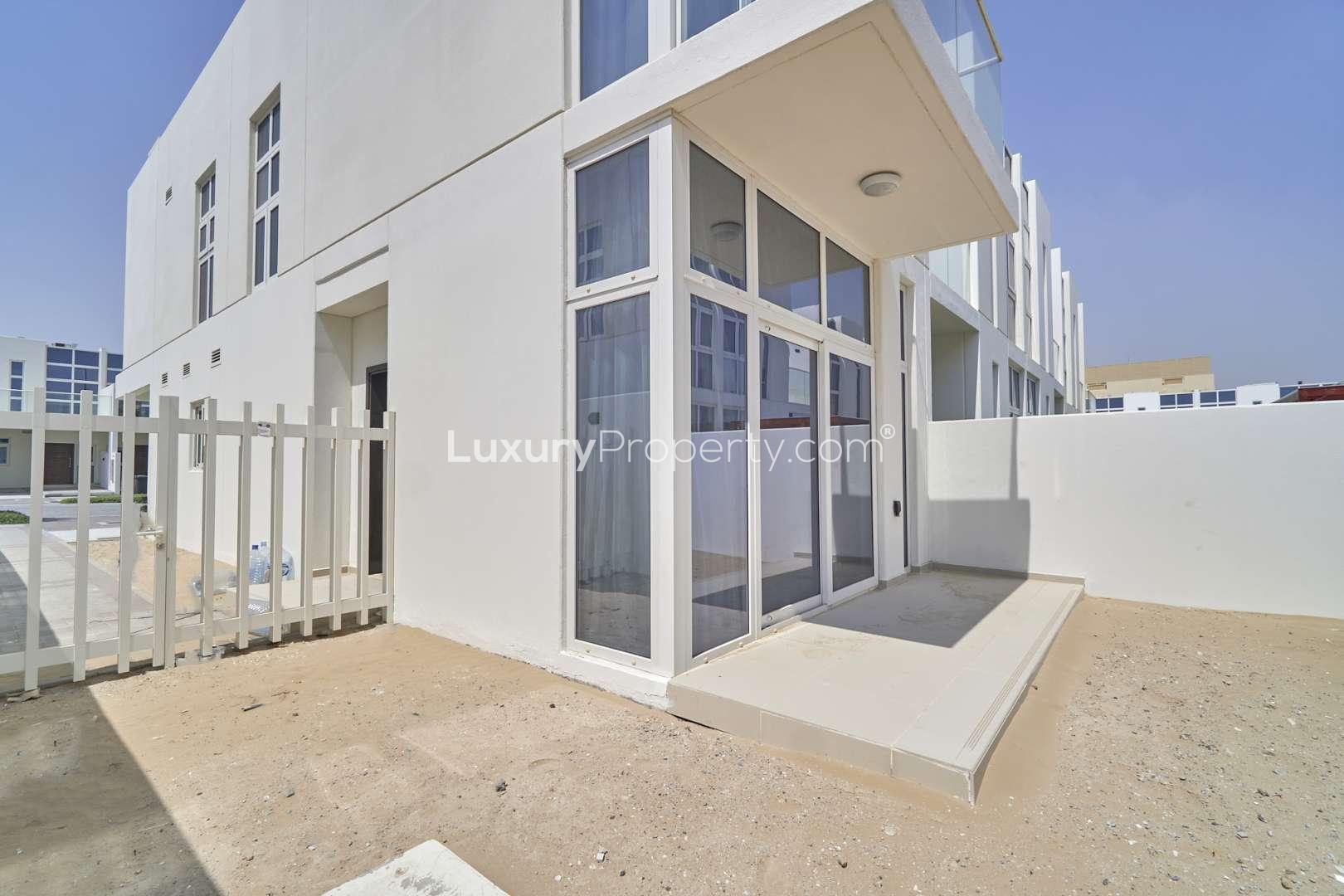Modern duplex townhouse exterior in Damac Hills 2, Akoya, Pacifica community, available for rent