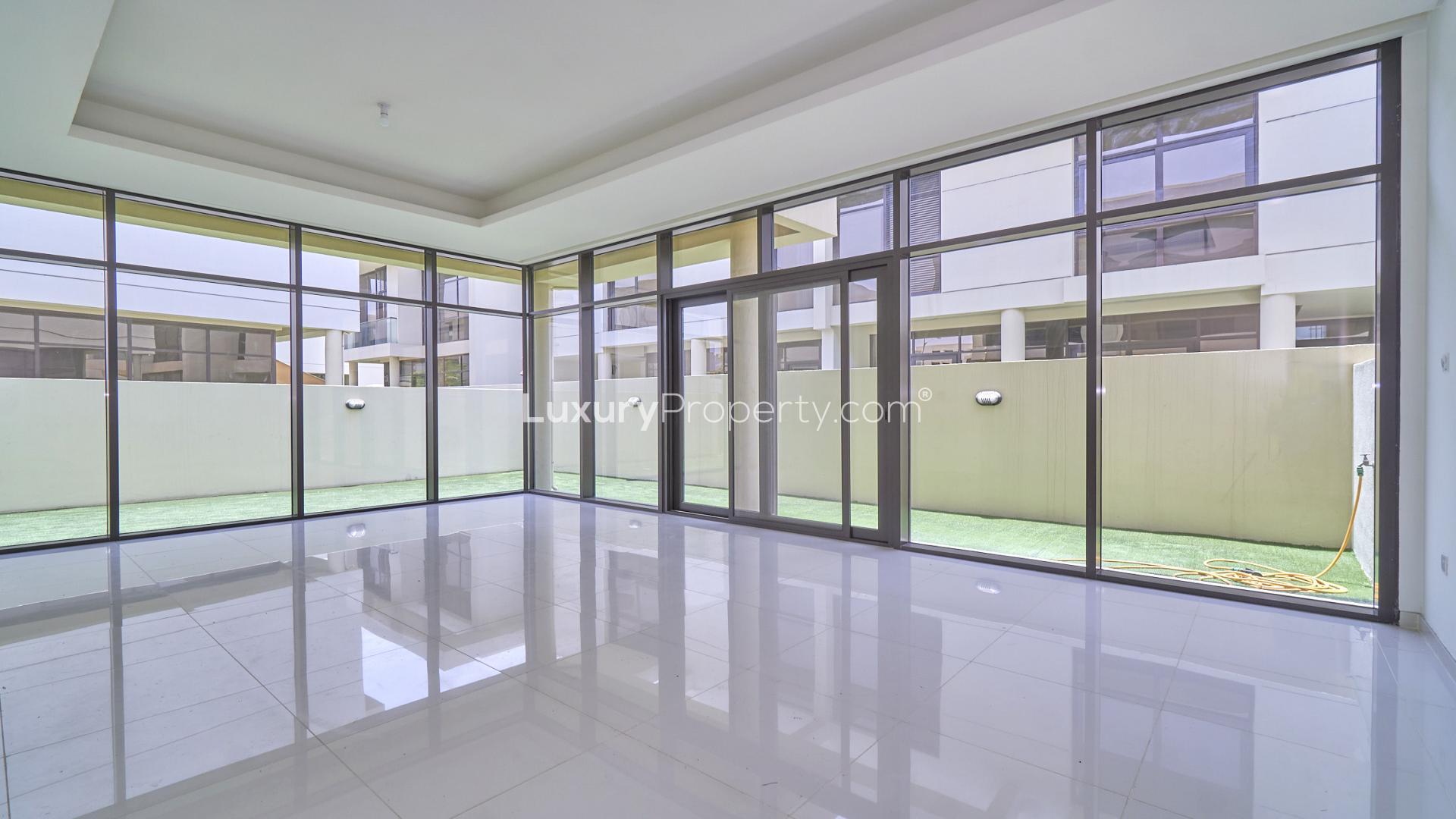 Spacious living area with large windows in Damac Hills townhouse for rent, Phoenix community