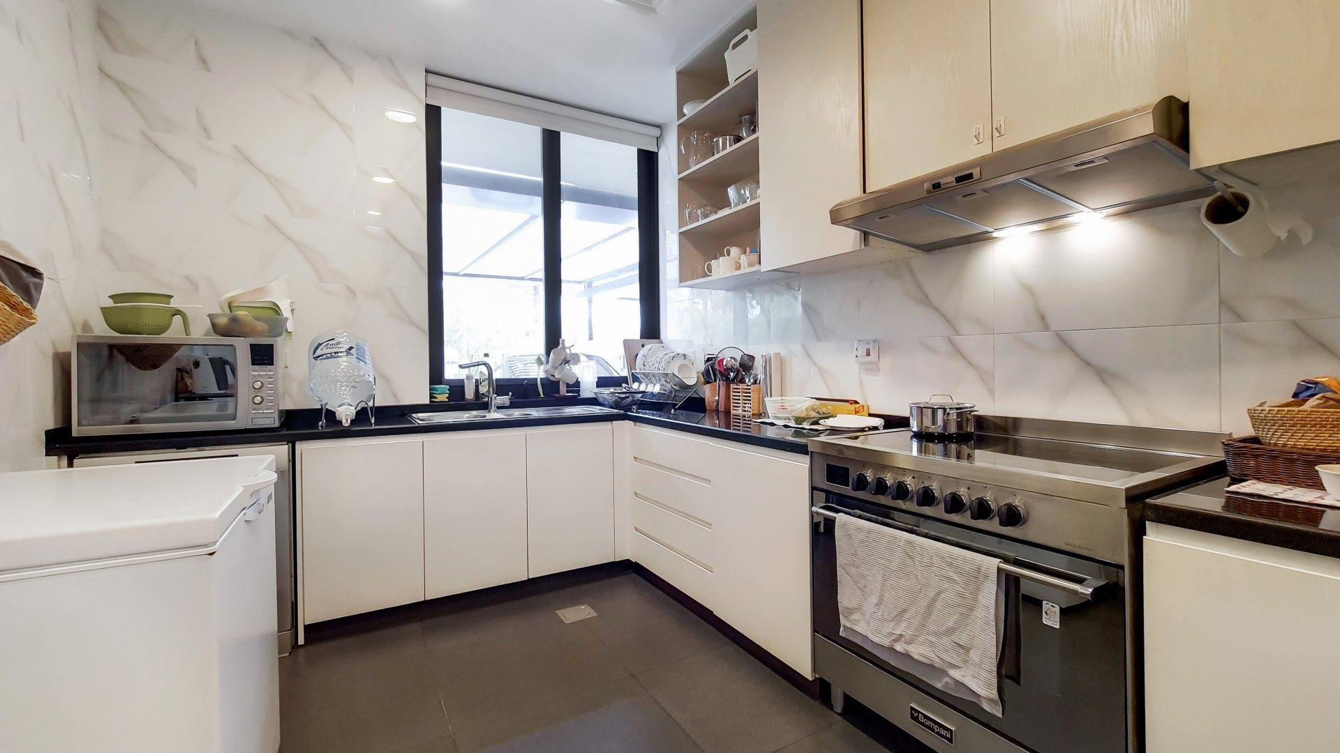 Spacious living room in Damac Hills townhouse, modern decor, open layout, Queens Meadow community