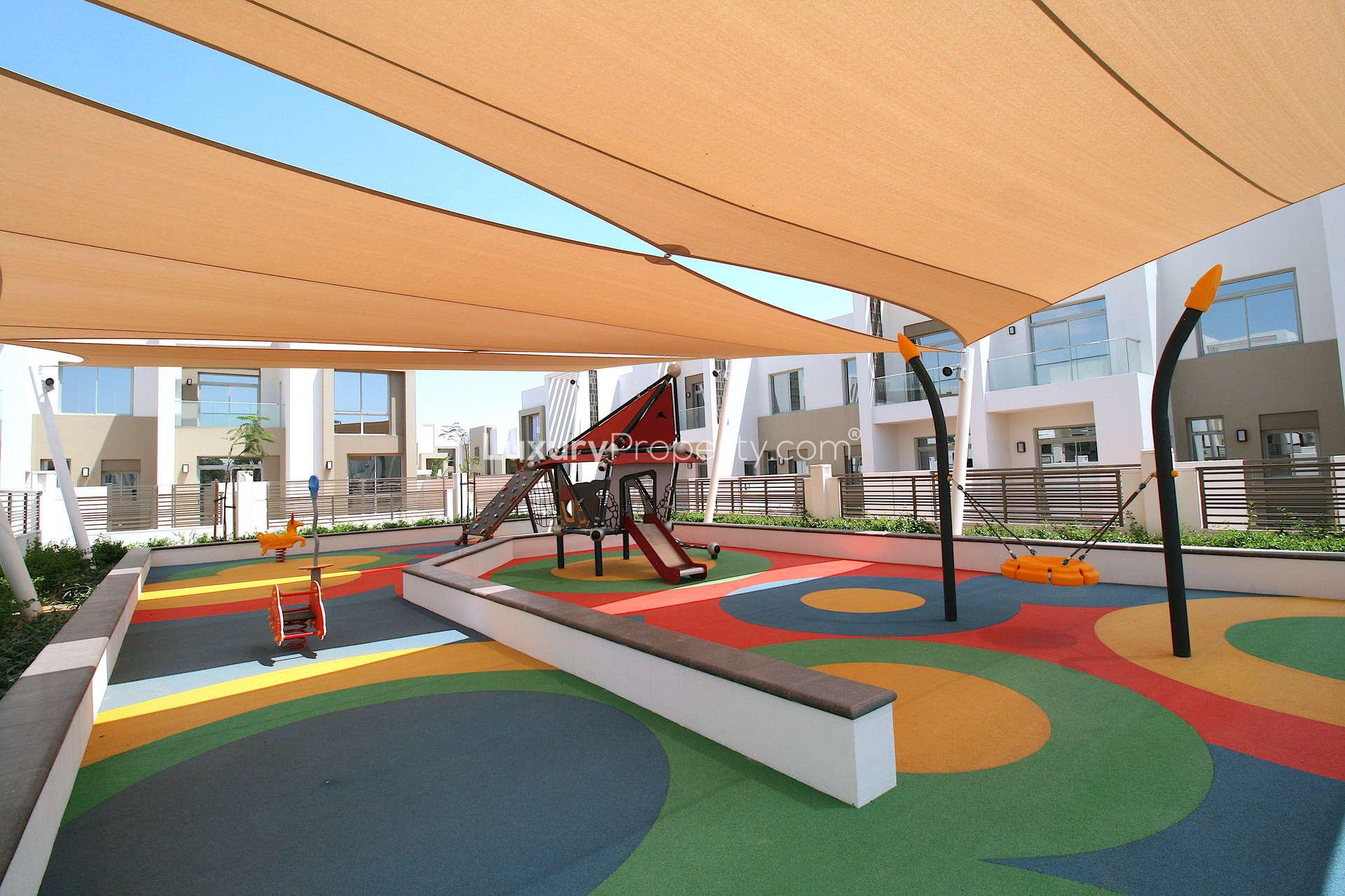 Outdoor playground in Reem Community, Arabian Ranches 2 townhouse, vibrant and family-friendly