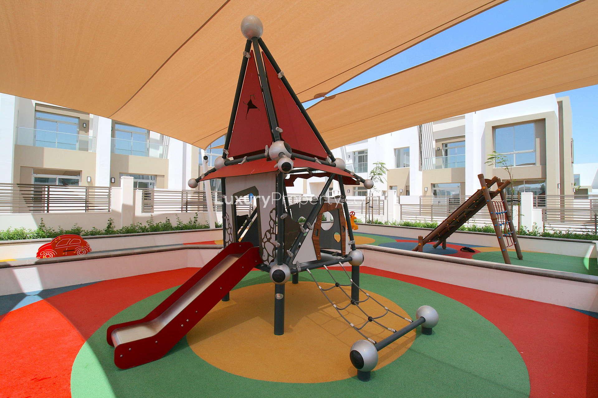 Empty bedroom with large window overlooking pool in Reem townhouse, Arabian Ranches 2