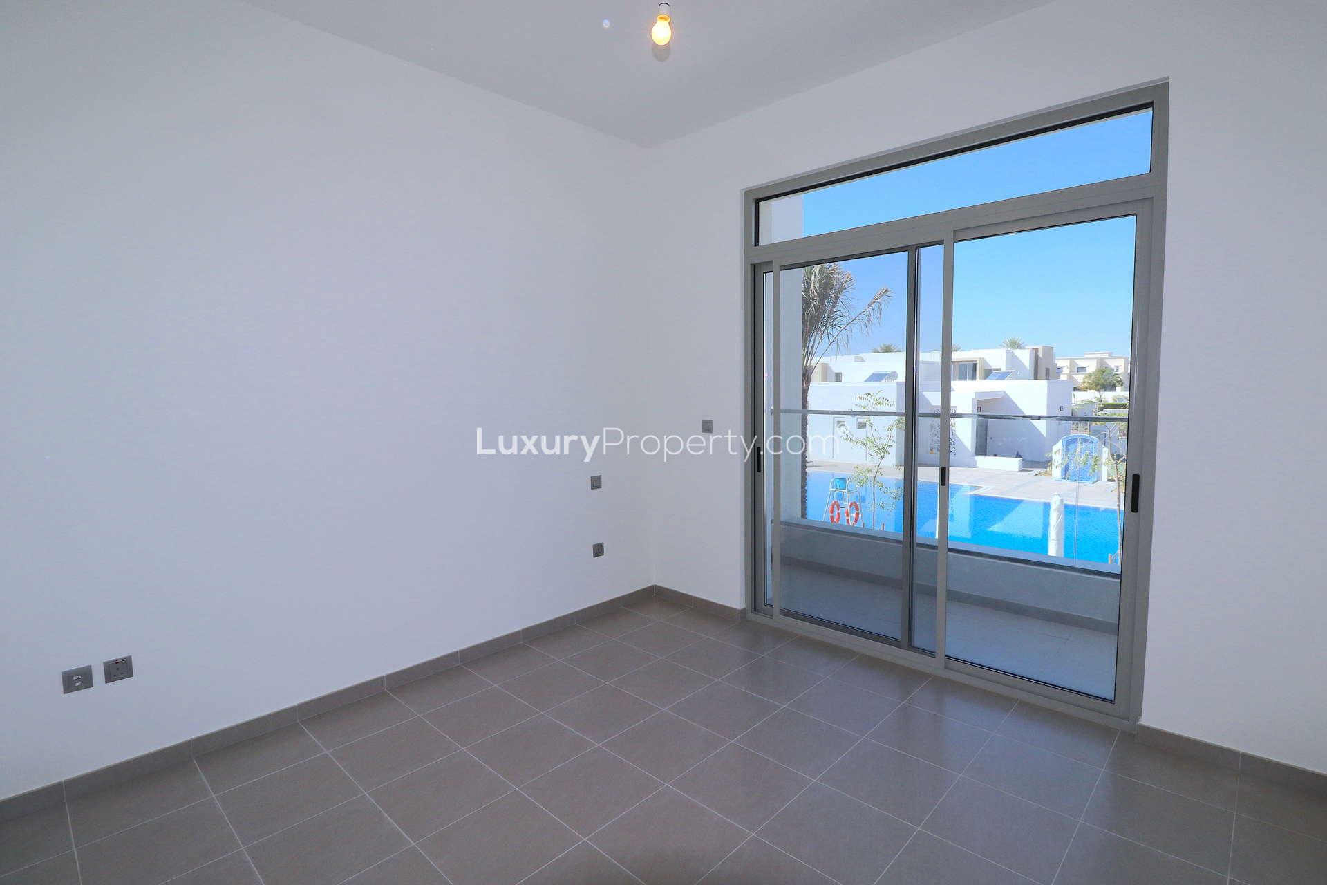 Modern 3-bedroom townhouse exterior in Reem, Arabian Ranches 2 for rent