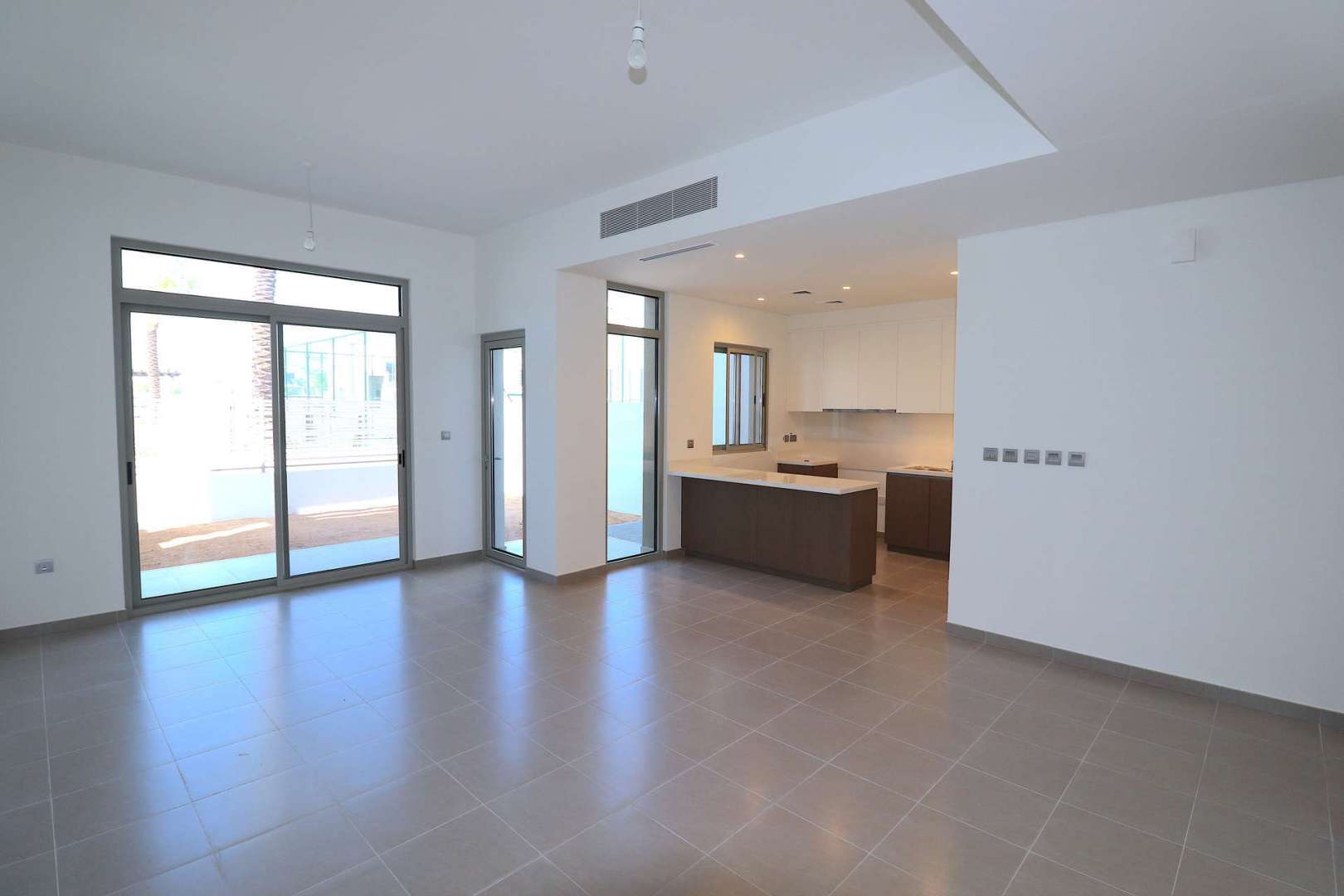 Open-plan kitchen and living area in 3-bedroom townhouse, Arabella 3, Arabian Ranches
