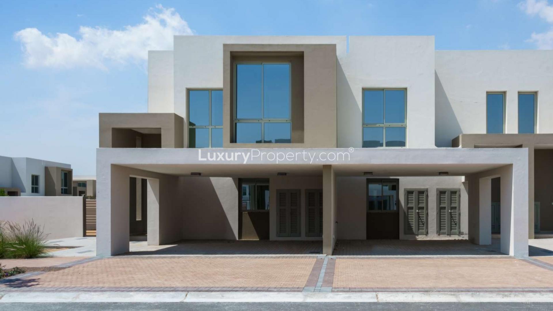 Modern open-plan kitchen and living area in Reem Community townhouse, Arabian Ranches 2