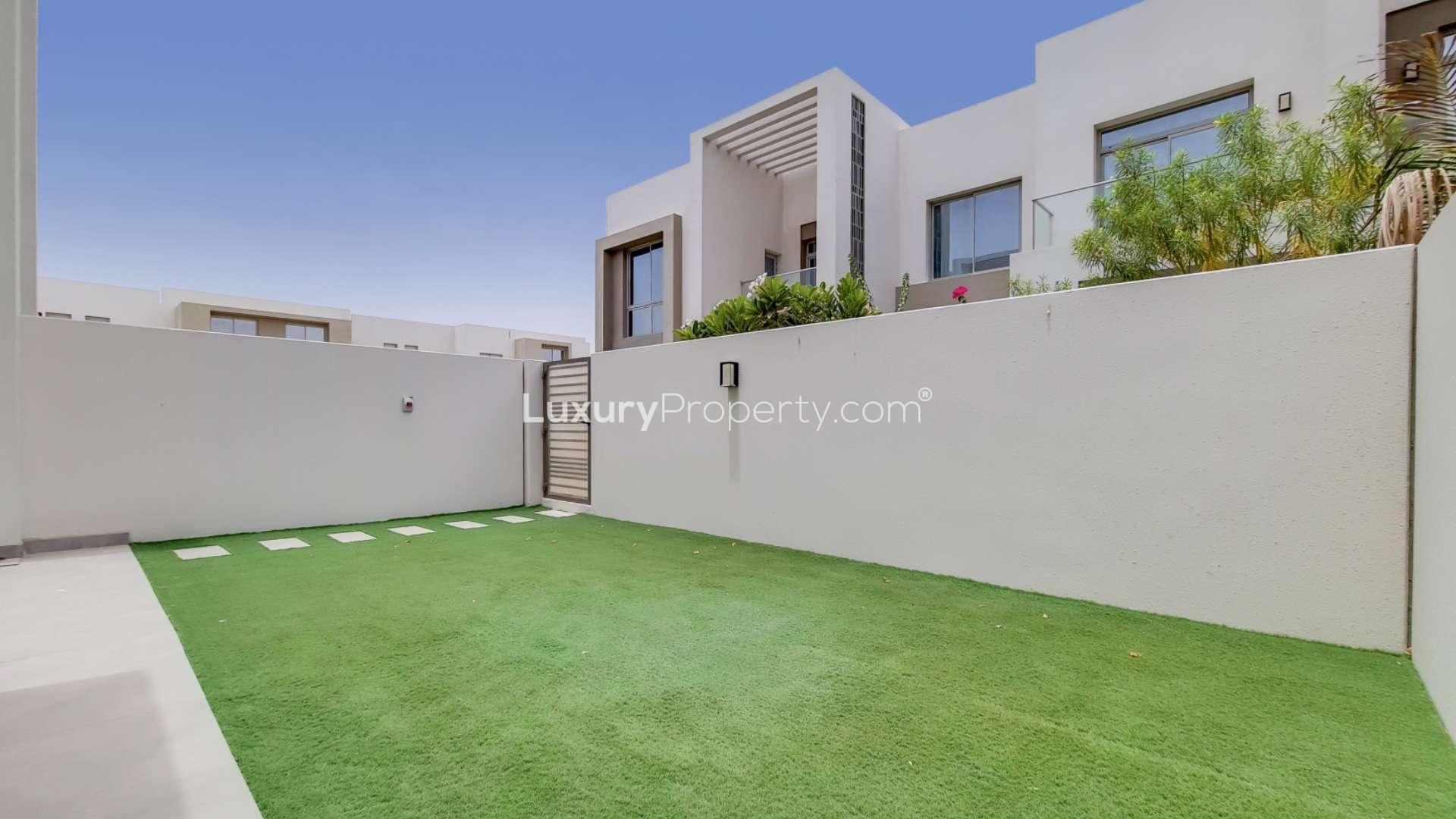 Modern townhouse exterior with private garden in Arabian Ranches 2, Reem Community