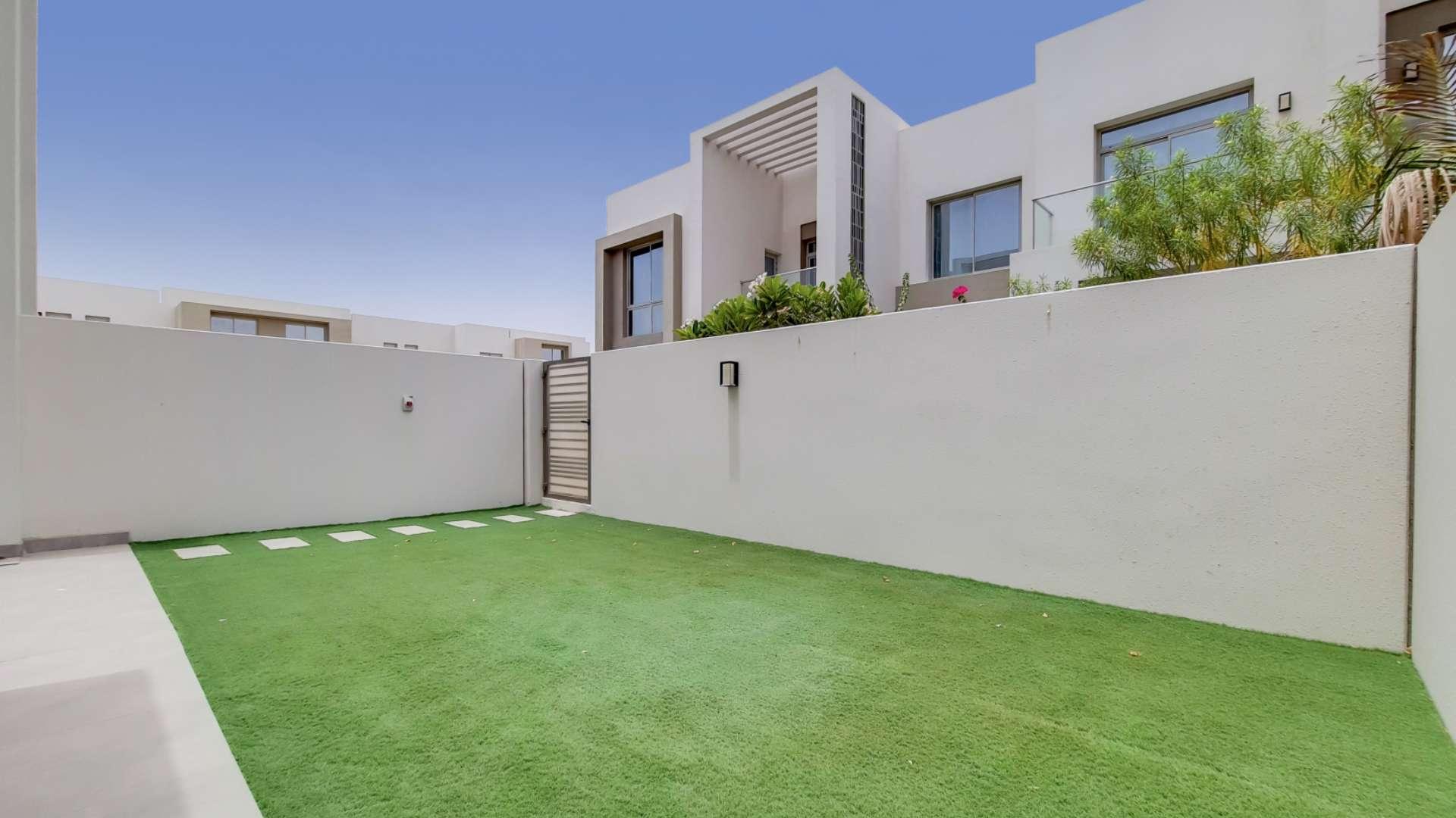 Modern townhouse exterior with private garden in Arabian Ranches 2, Reem Community