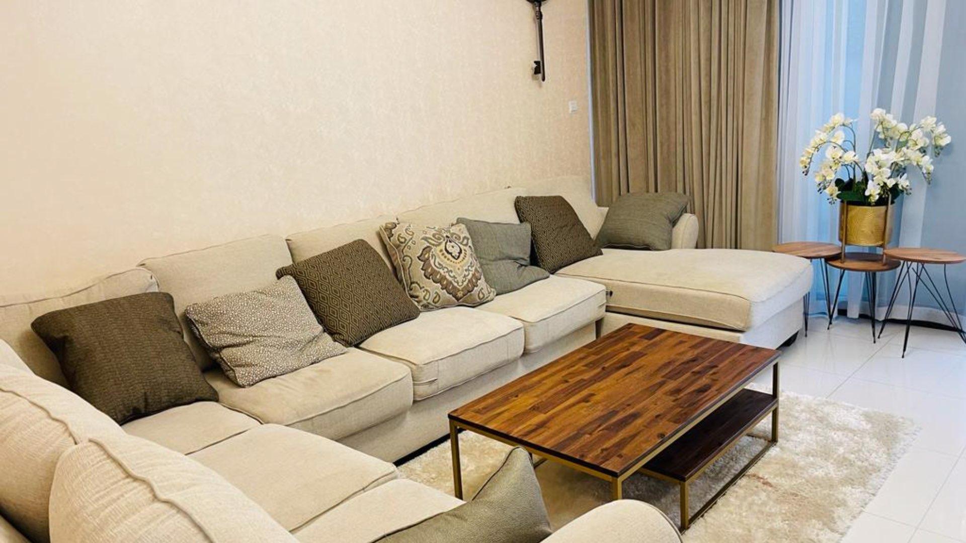 Private swimming pool with seating area in Damac Hills Rochester townhouse for rent