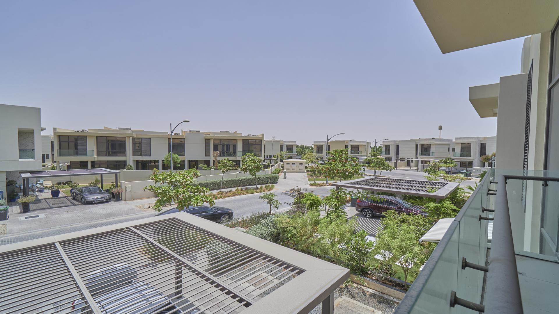 Bright living area with large windows in Damac Hills Rockwood townhouse for rent