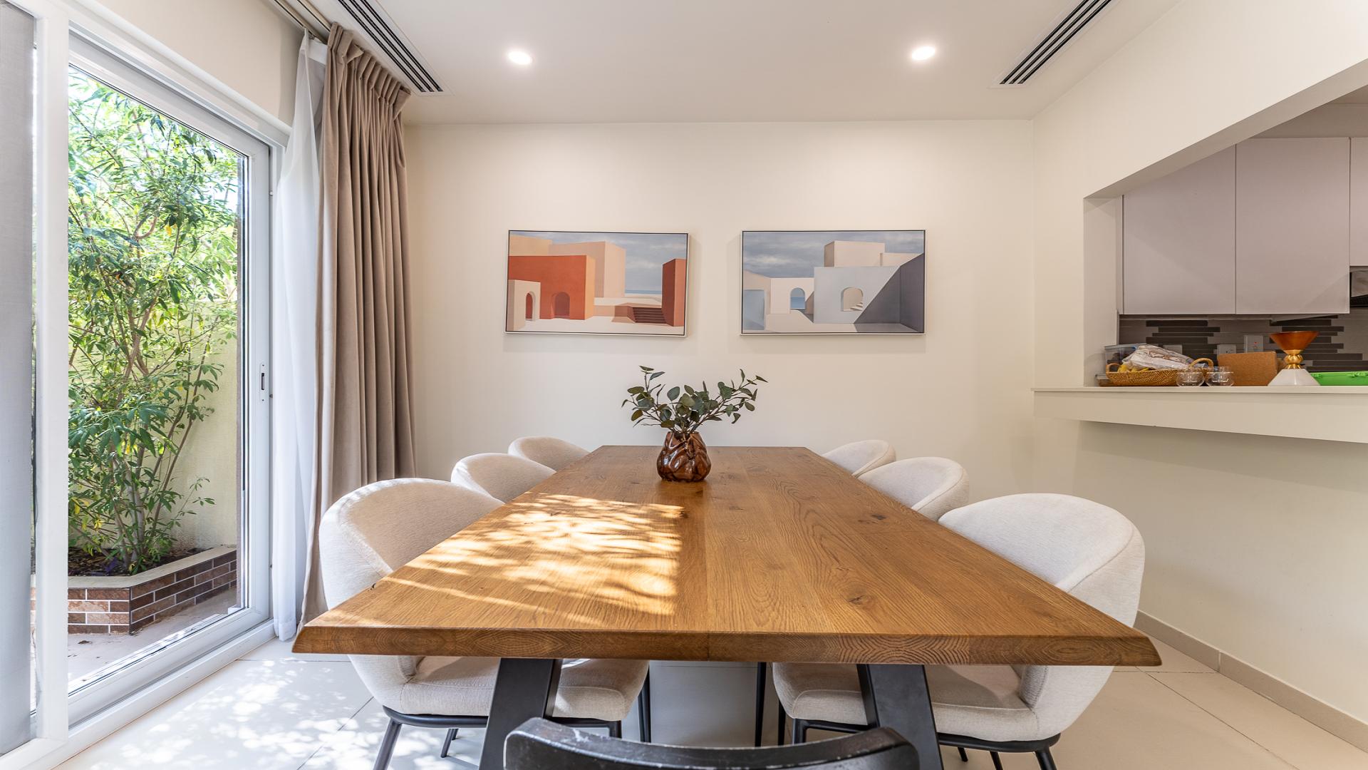 Modern living room in Villanova Amaranta townhouse for rent, featuring cozy seating and decor