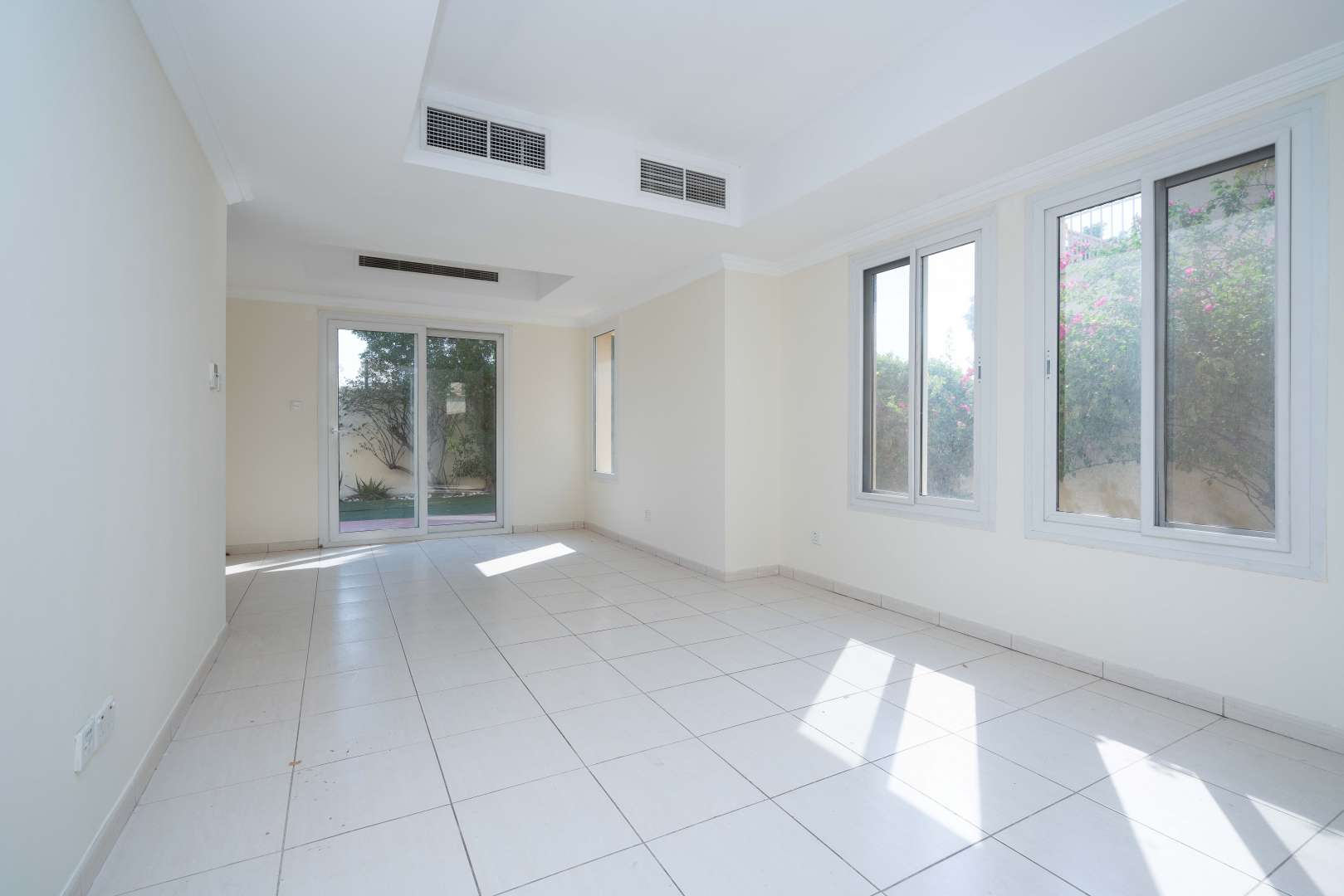 Spacious living room in vacant Springs 4 townhouse for rent, natural light and garden view