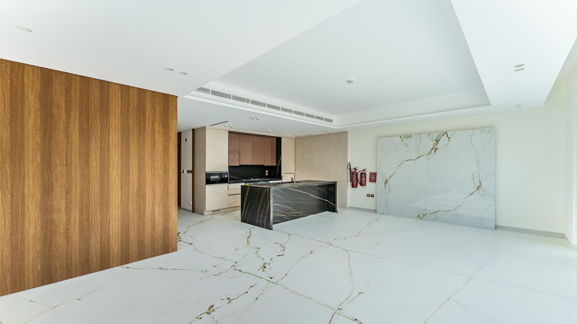 Modern living room with marble floors and large windows in Jasmine Lane townhouse